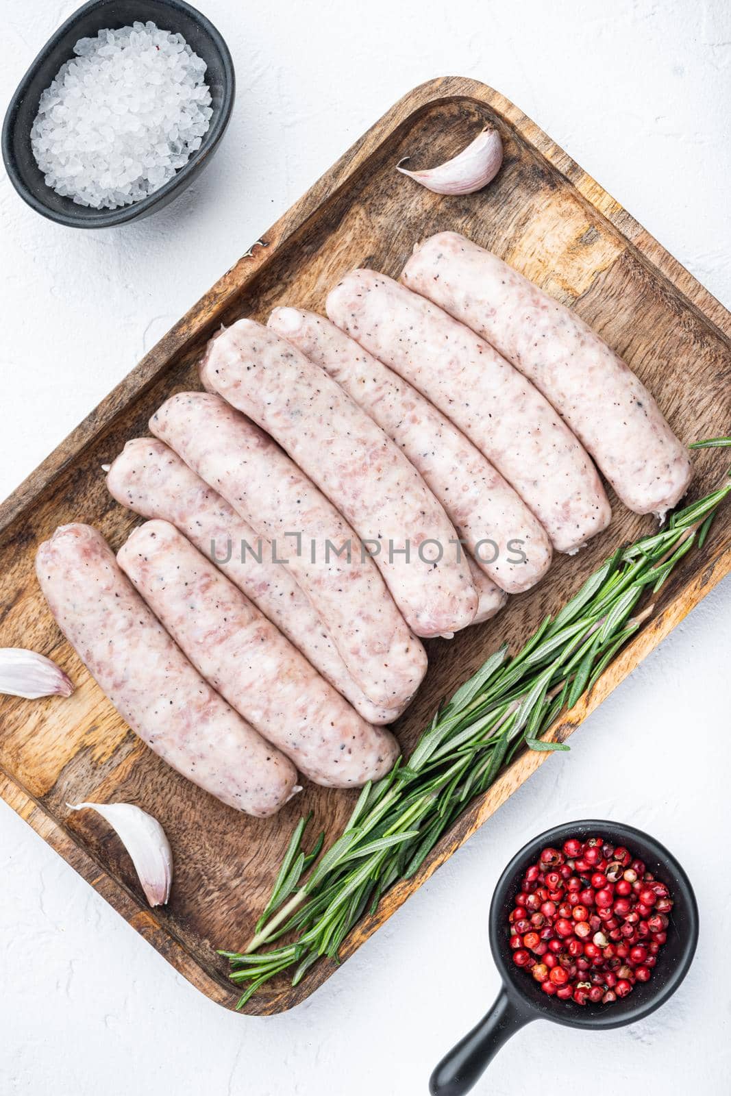 Traditional raw sausages, flat lay, on white background by Ilianesolenyi