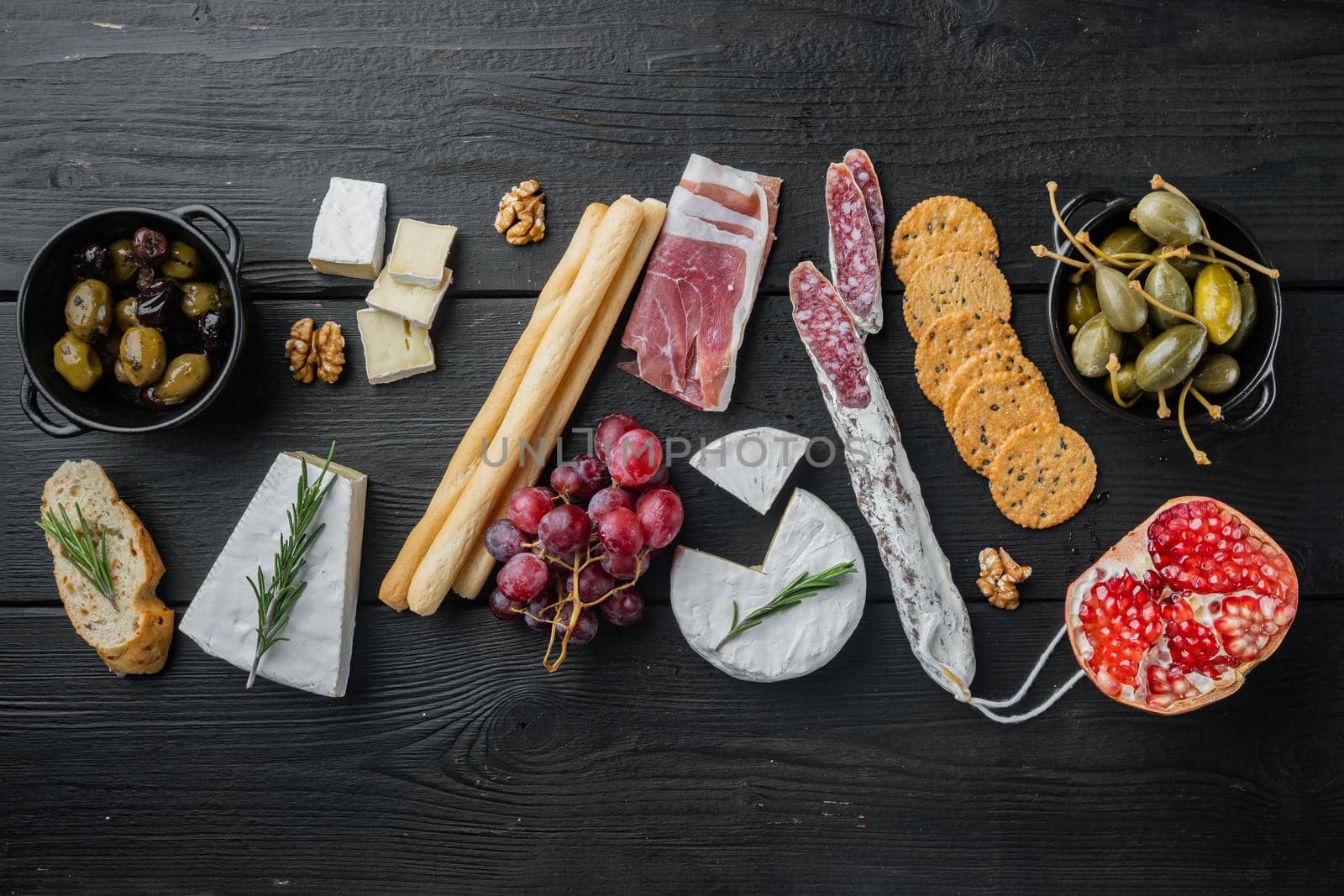 Ingredients for mediterranean food, meat cheede, herbs set, on black wooden table, flat lay