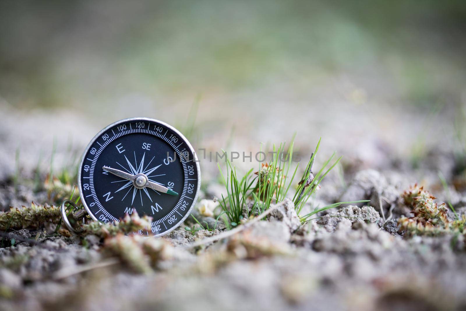Adventure: Compass is lying on the floor, showing the direction by Daxenbichler
