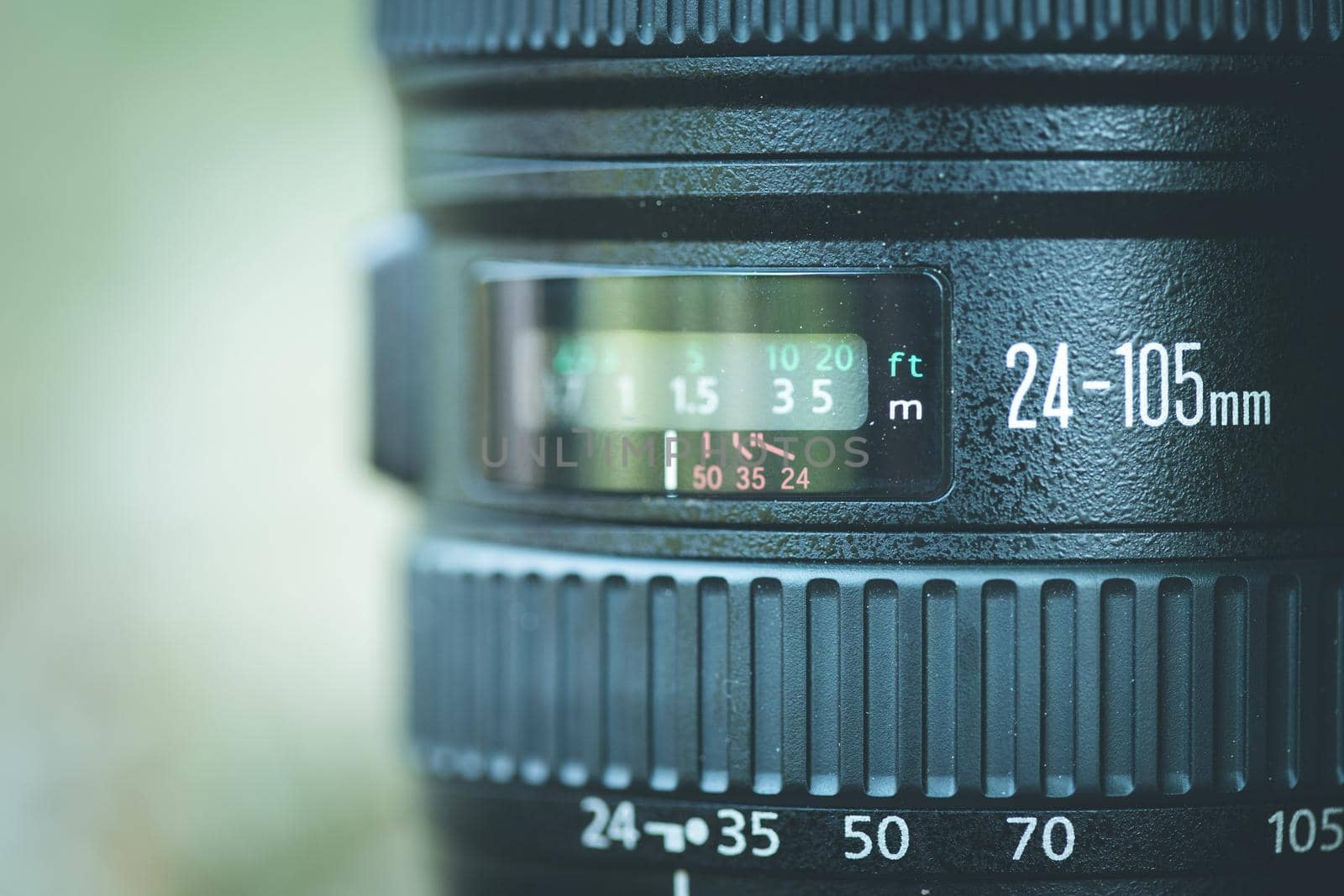 Professional optic photo lens outdoors. Warm colors, blurry background. by Daxenbichler