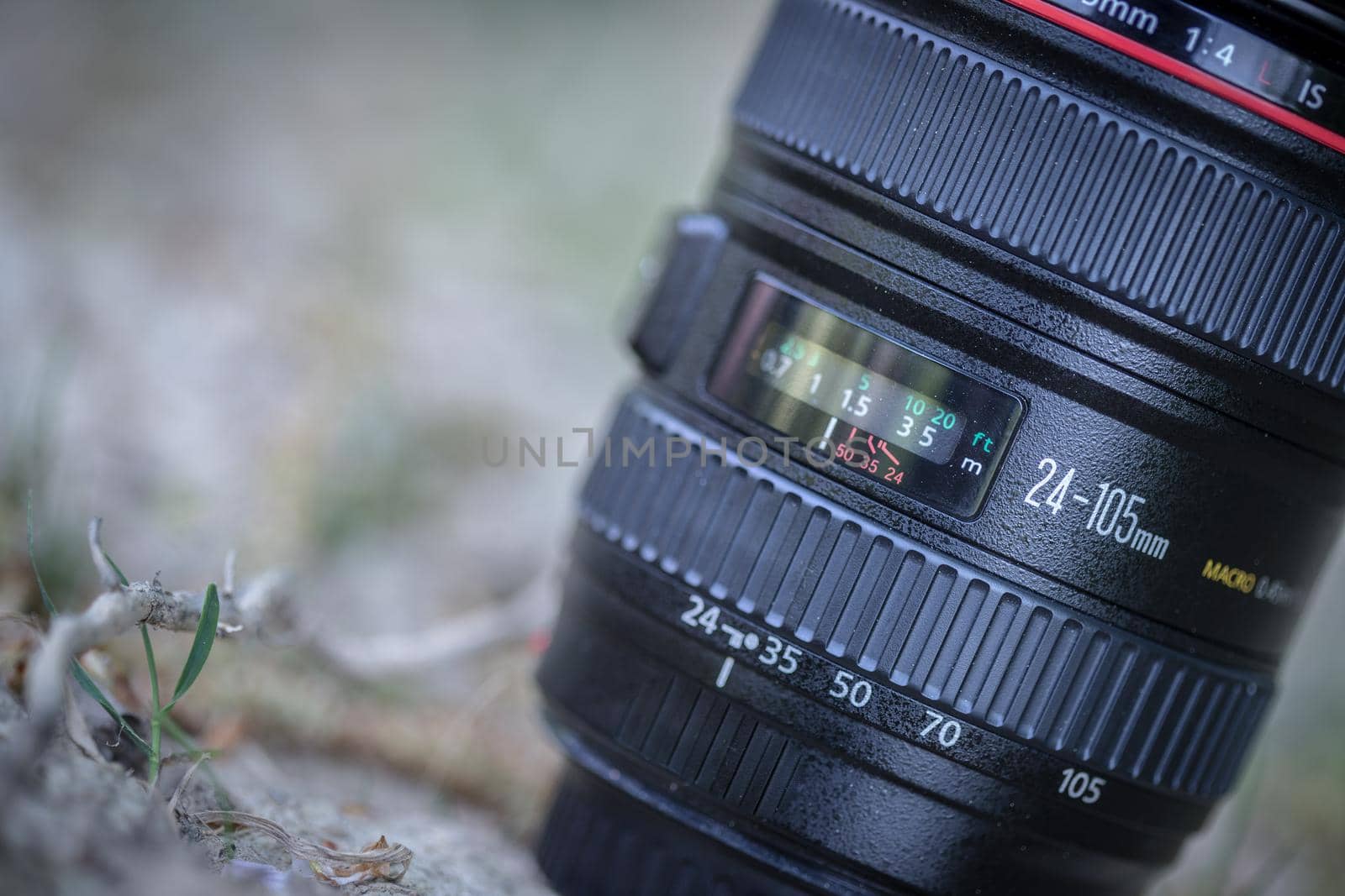 Professional optic photo lens outdoors. Warm colors, blurry background. by Daxenbichler
