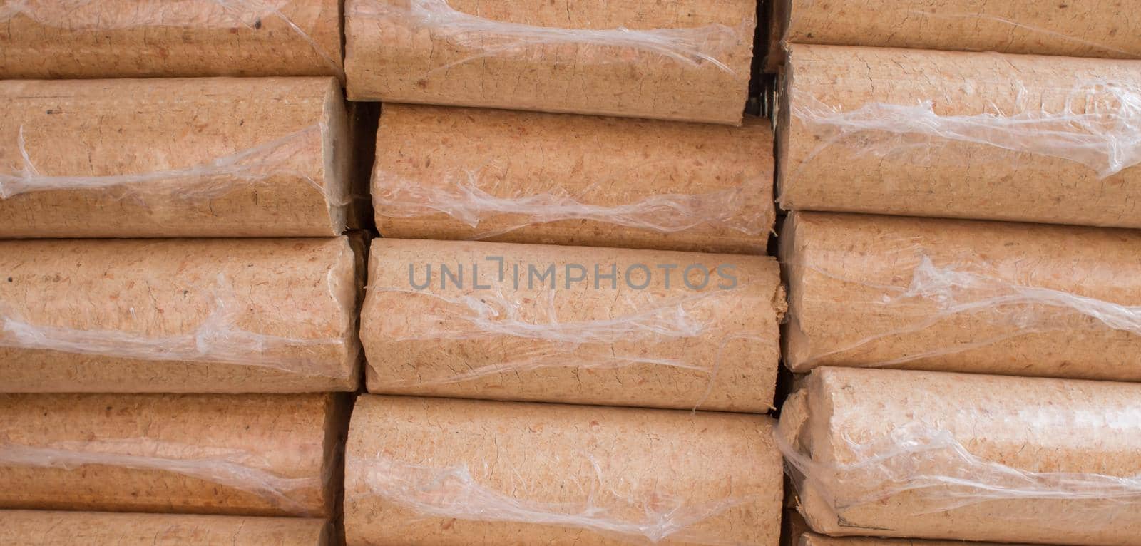 Wood briquettes for heating, packed in plastic film