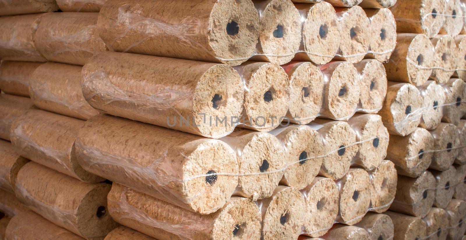 Wood briquettes for heating, packed in plastic film