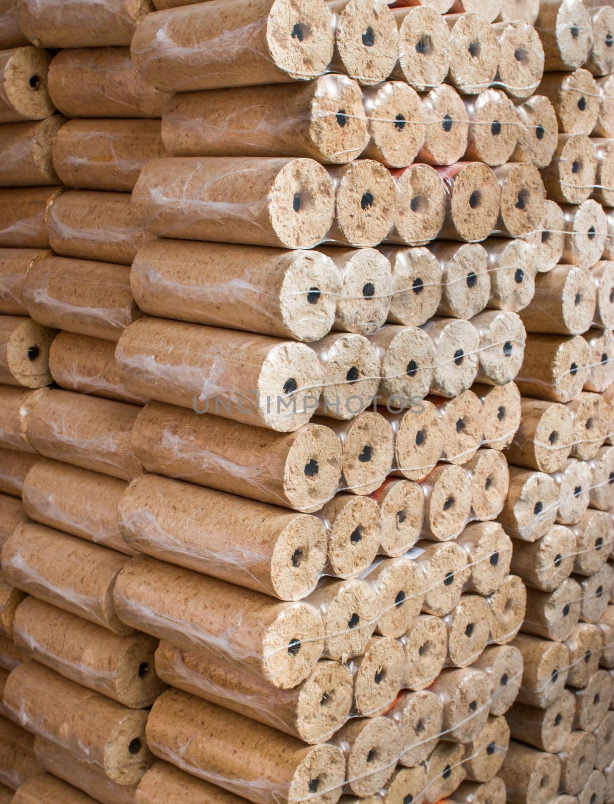 Wood briquettes for heating, packed in plastic film