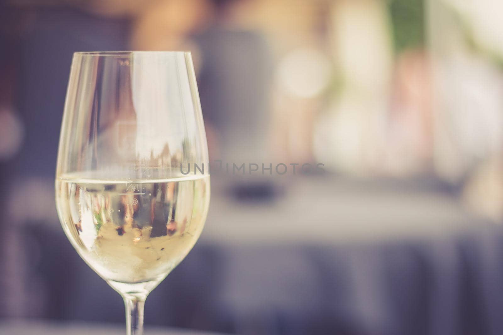 Cut out of a glass with white wine, summer time