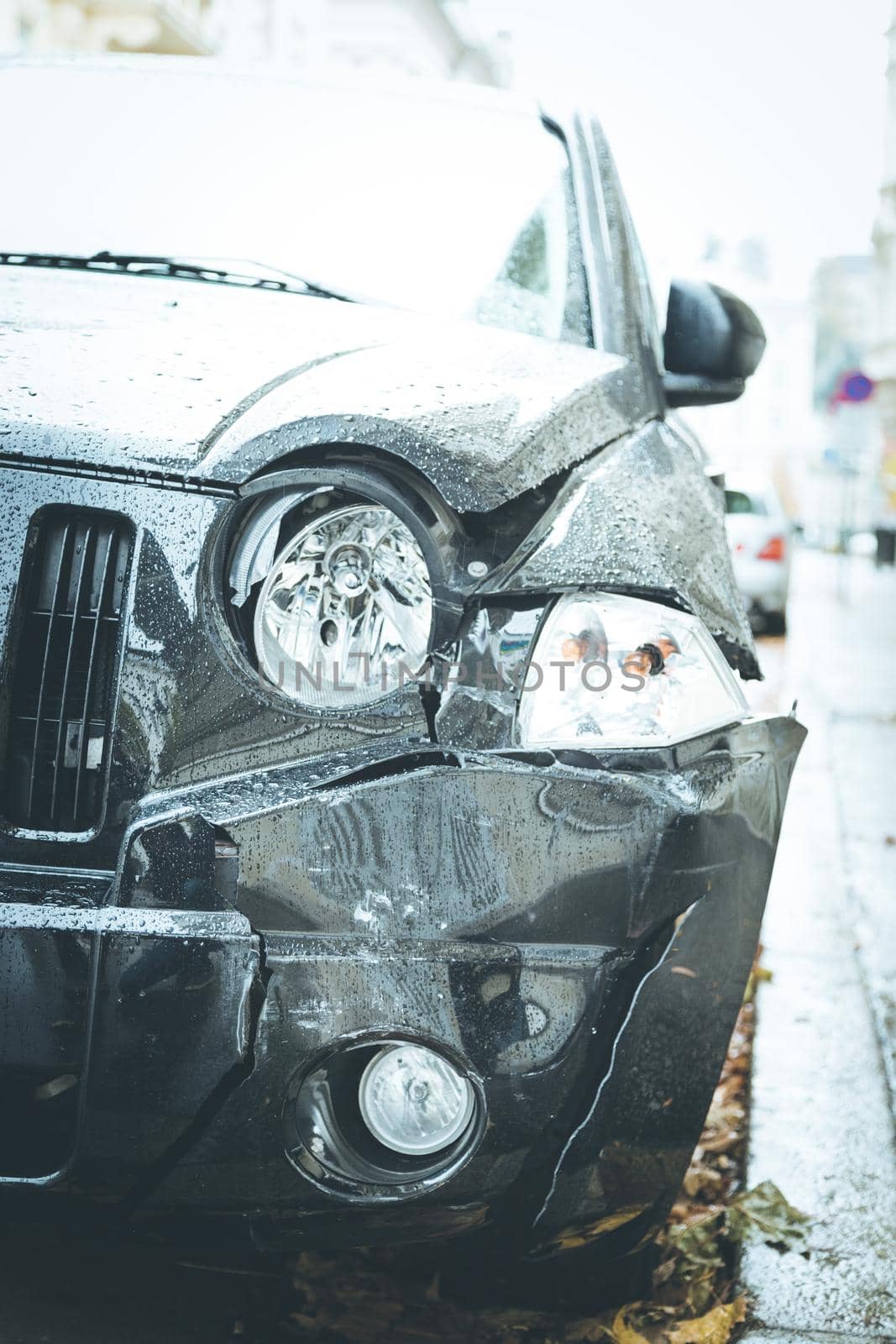 Close up of black damaged car, front view