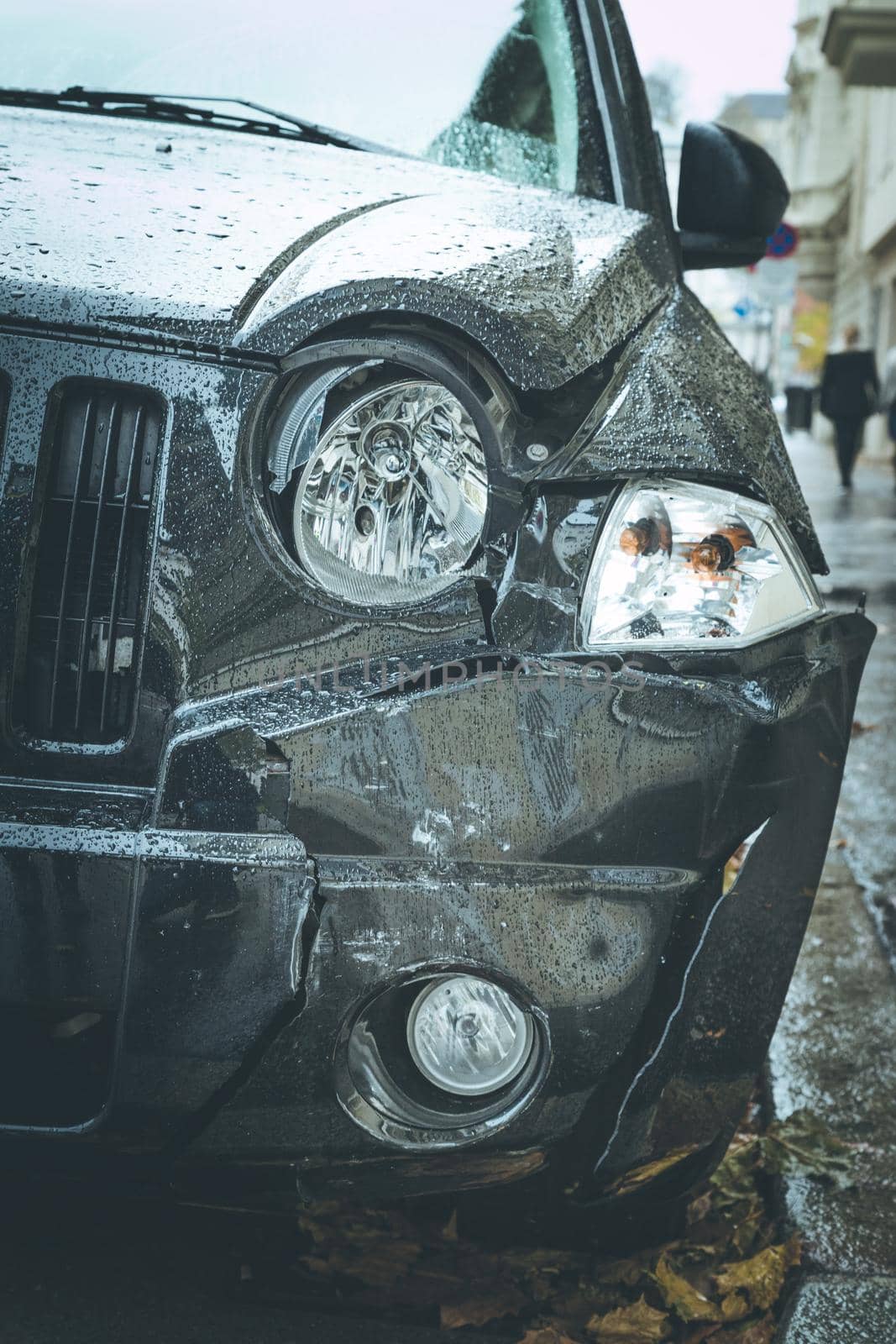 Close up of black damaged car, front view