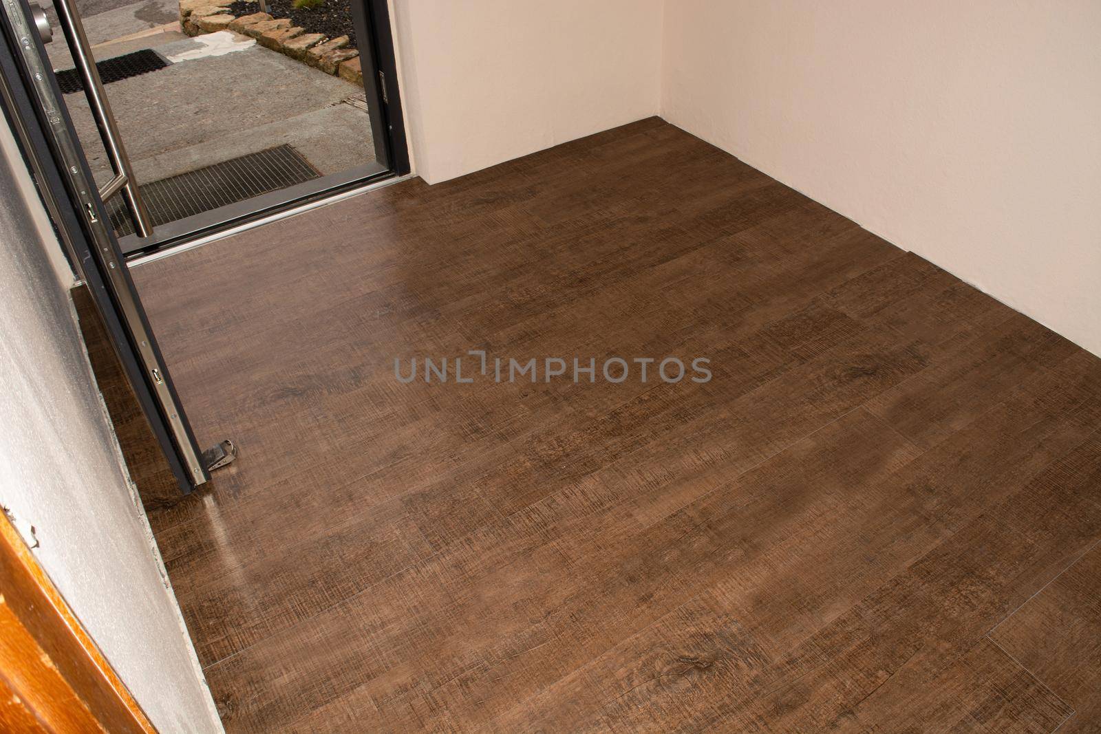 Laminate flooring. Threaded panel of a laminate floor on a thermally insulated floor. Electric underfloor heating, radiant heating, infrared carbon heating foil for the floor