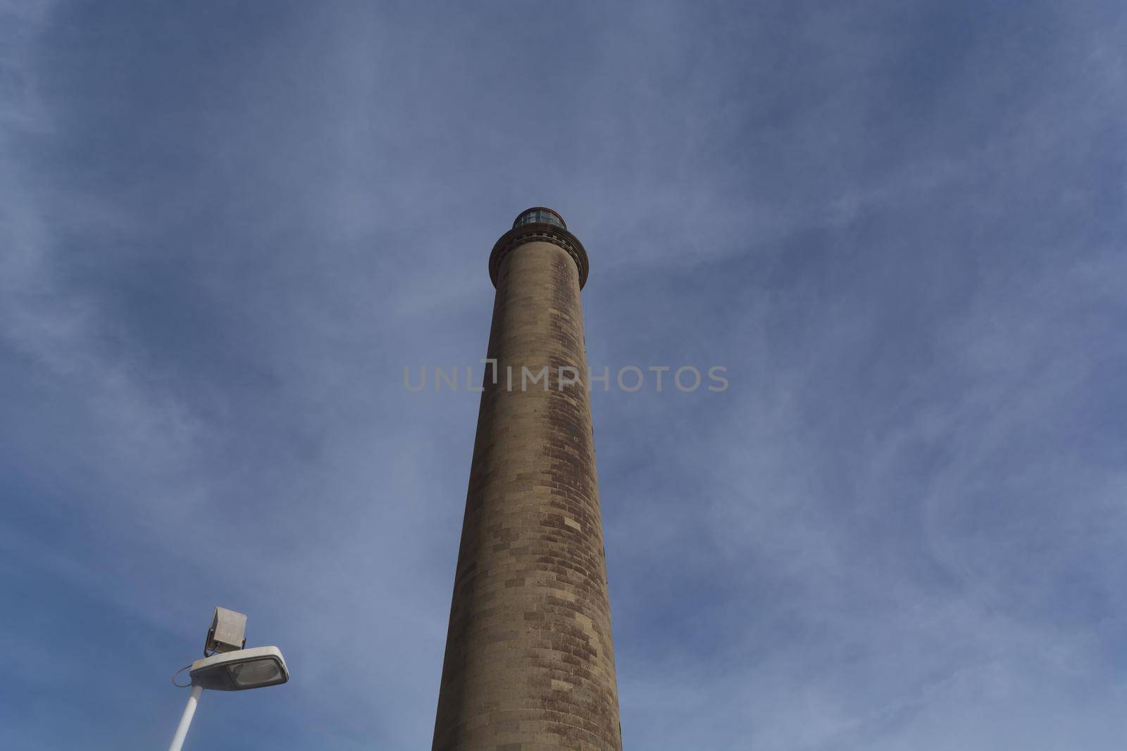 Faro de Maspalomas lighthouse on Gran Canaria in front of blue sky, Meloneras, Playa del Ingles.