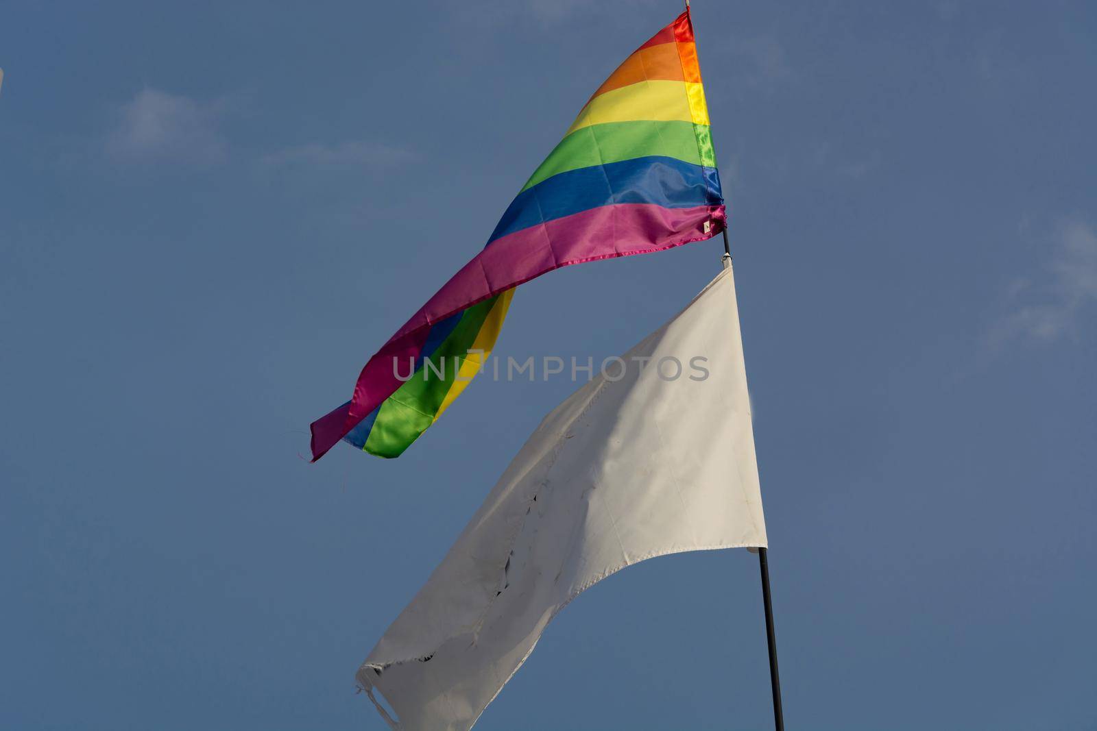 Rainbow flag on a gay beach by JFsPic