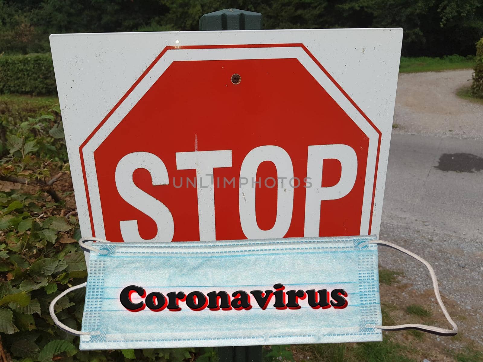 Coronavirus disease 2019-nCoV. Respirator mask with the word Coronavirus in front of a stop sign.
