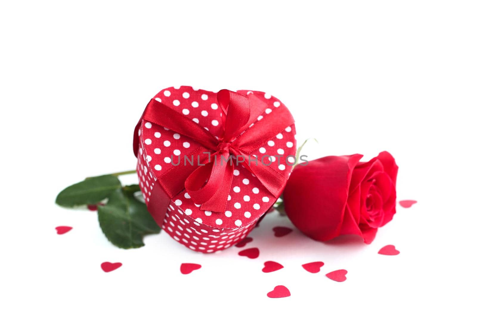 Rose, gift and hearts isolated on white background