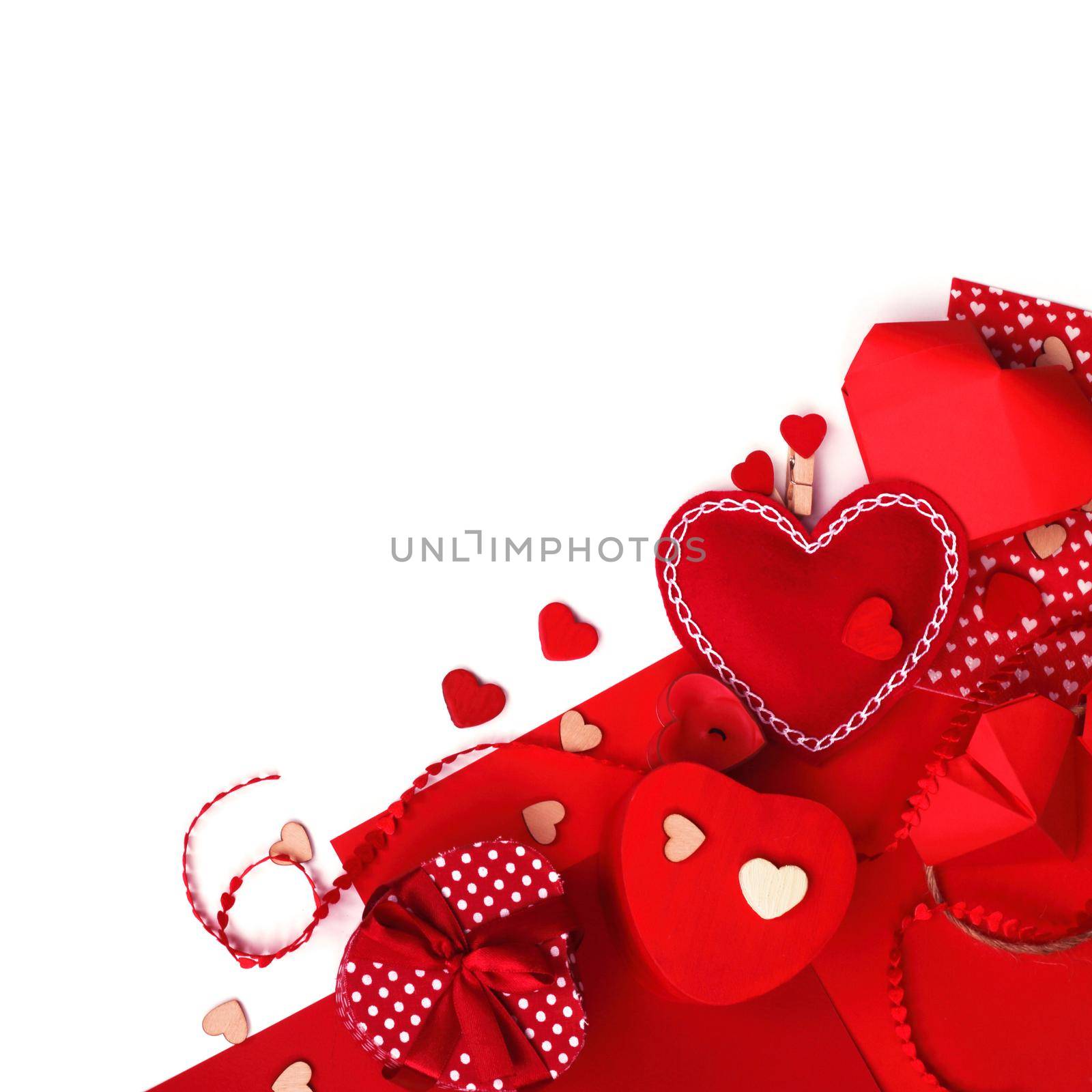 Many valentine day hearts and decor, homemade craft concept, red fabric, paper, gifts and candles, isolated on white background copy space for text