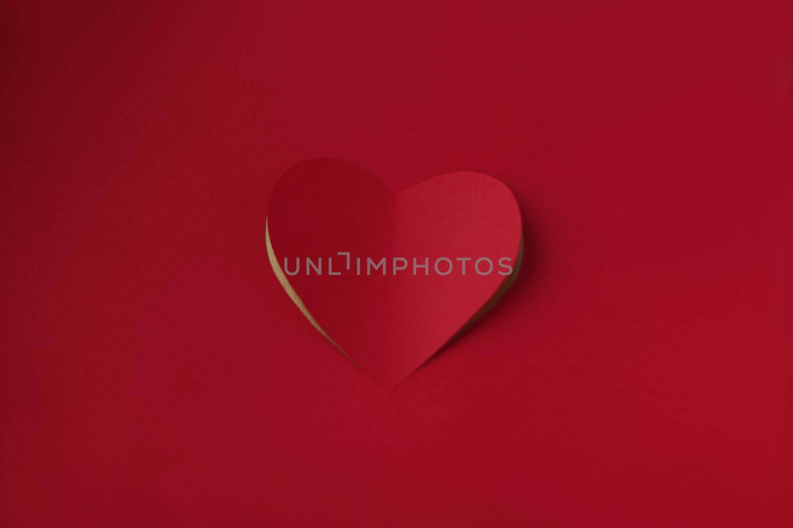 Heart cut from red paper background, Valentines day card