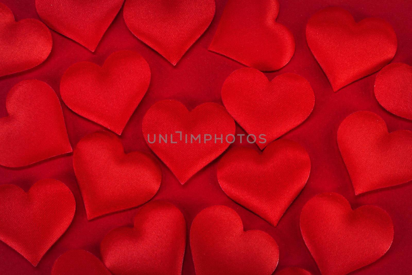 Valentine's day many red silk hearts background, love concept