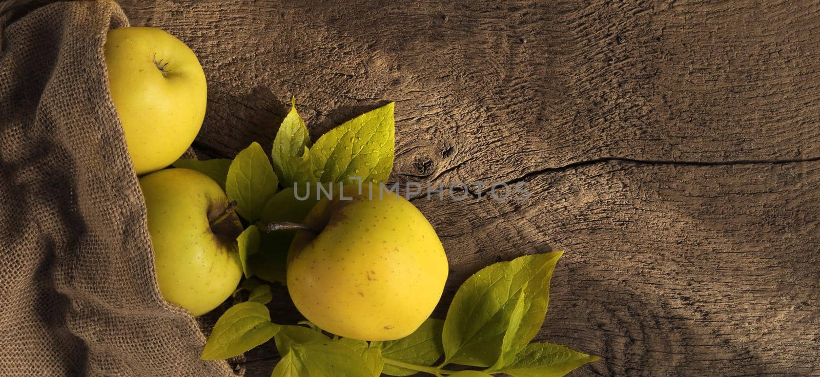 Rustic background with green yellow apples by NelliPolk
