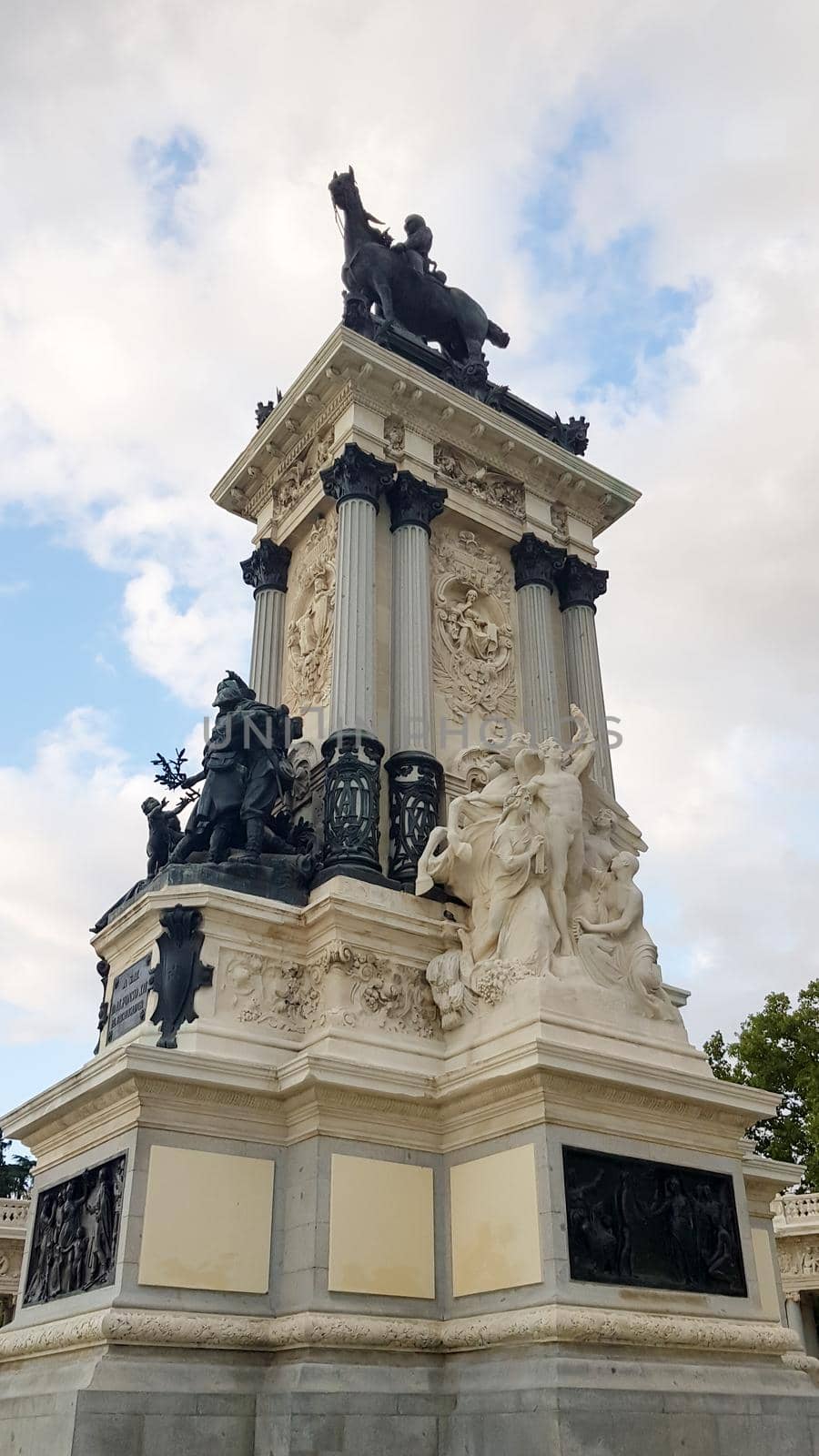 King Alfonso XII monument at El Retiro Park, Madrid during sunset. Iconic Park in the capital city of Spain.