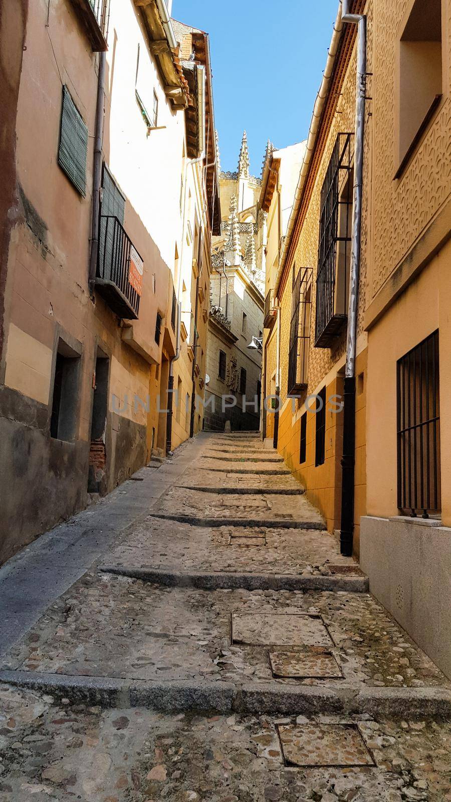 Paved street and houses in Segovia, Spain