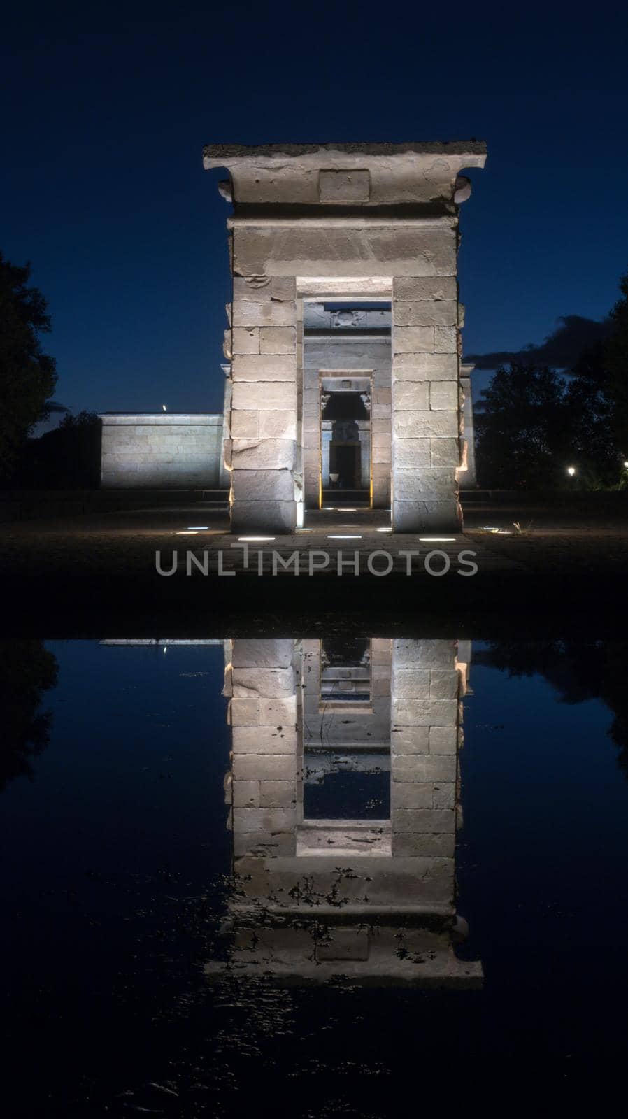 Front view reflection of Temple of Debod at night, Madrid, Spain by codrinn