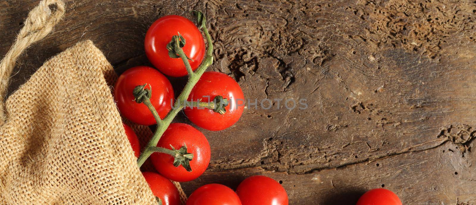 Rustic background with tomatoes by NelliPolk