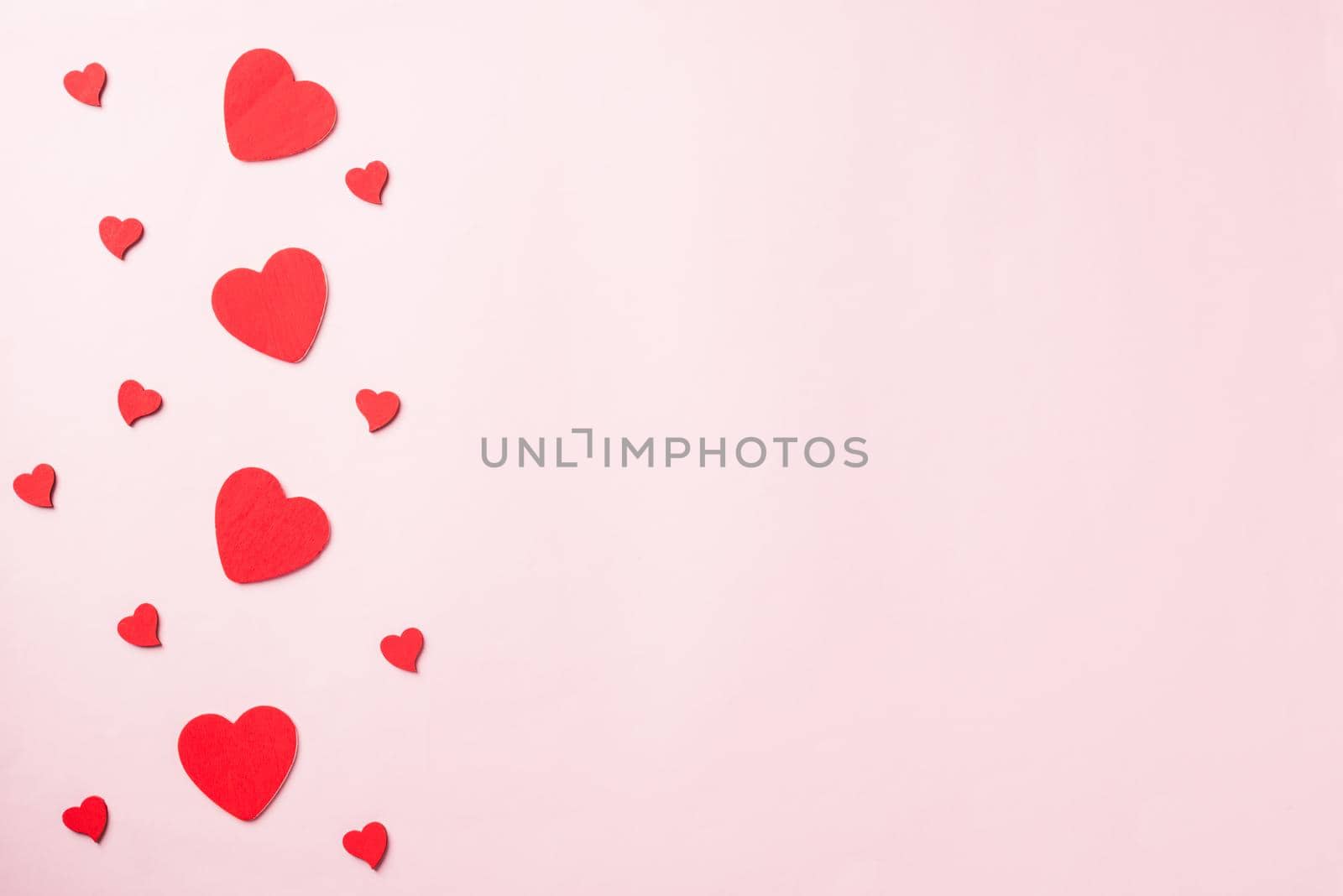 Valentines' day background. red hearts composition greeting card for love Valentines day concept isolated on pink background with copy space. Top View flat lay from above