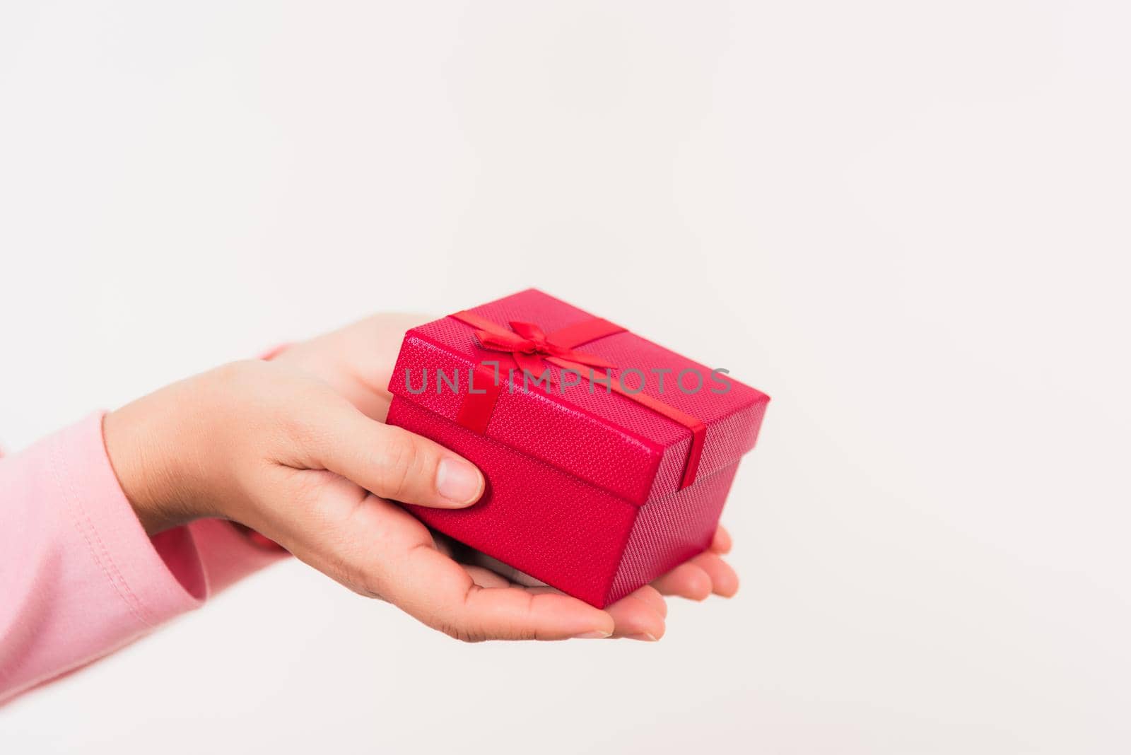 Woman beauty hands holding small gift package box present by Sorapop