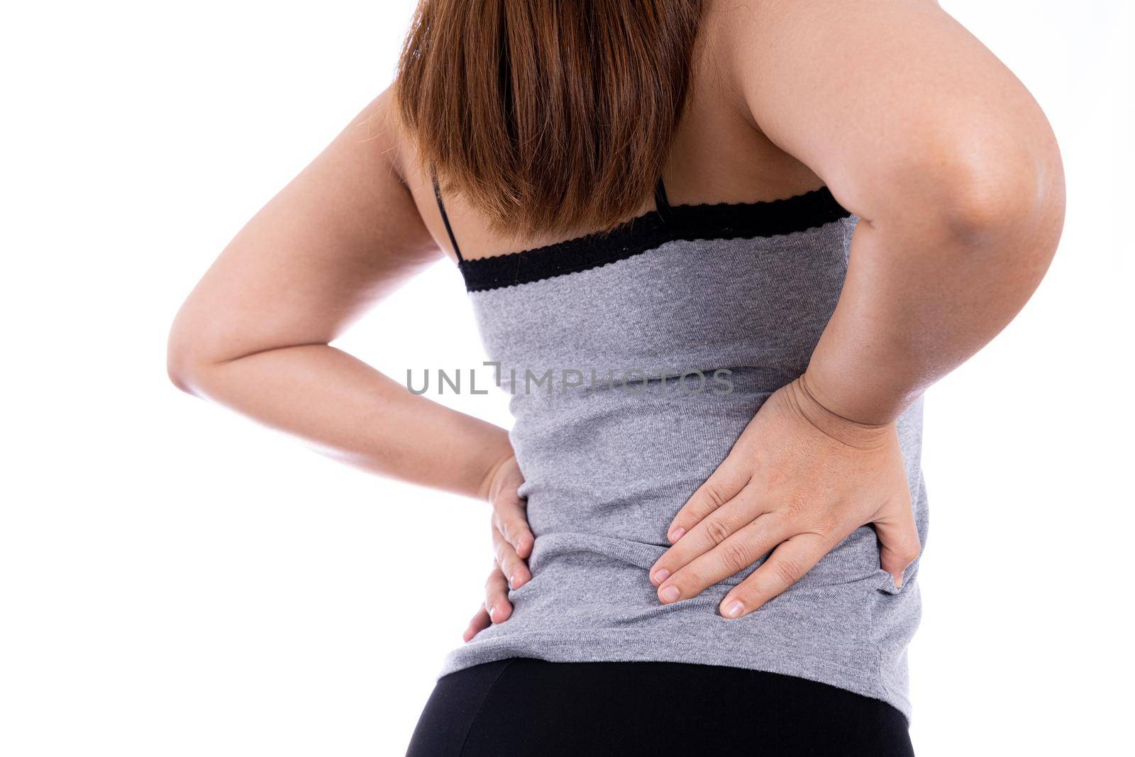 Woman suffering from waist and back pain isolated white background. Health care and medical concept.