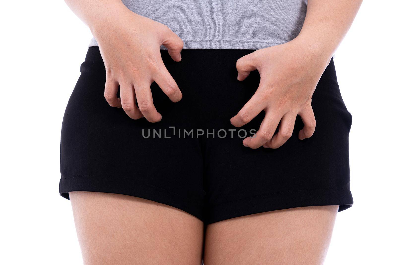 Woman hands scratching her crotch isolated white background. Medical, healthcare for advertising concept.