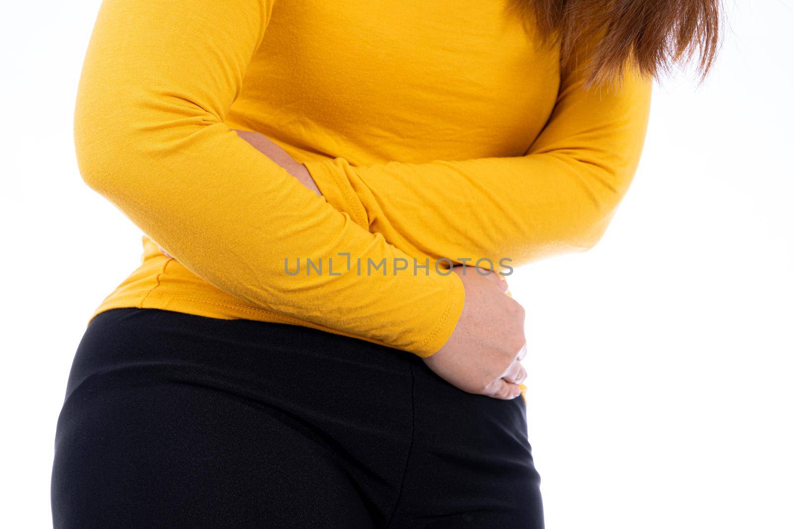 Woman suffering from stomach pain and injury isolated white background. Health care and medical concept.