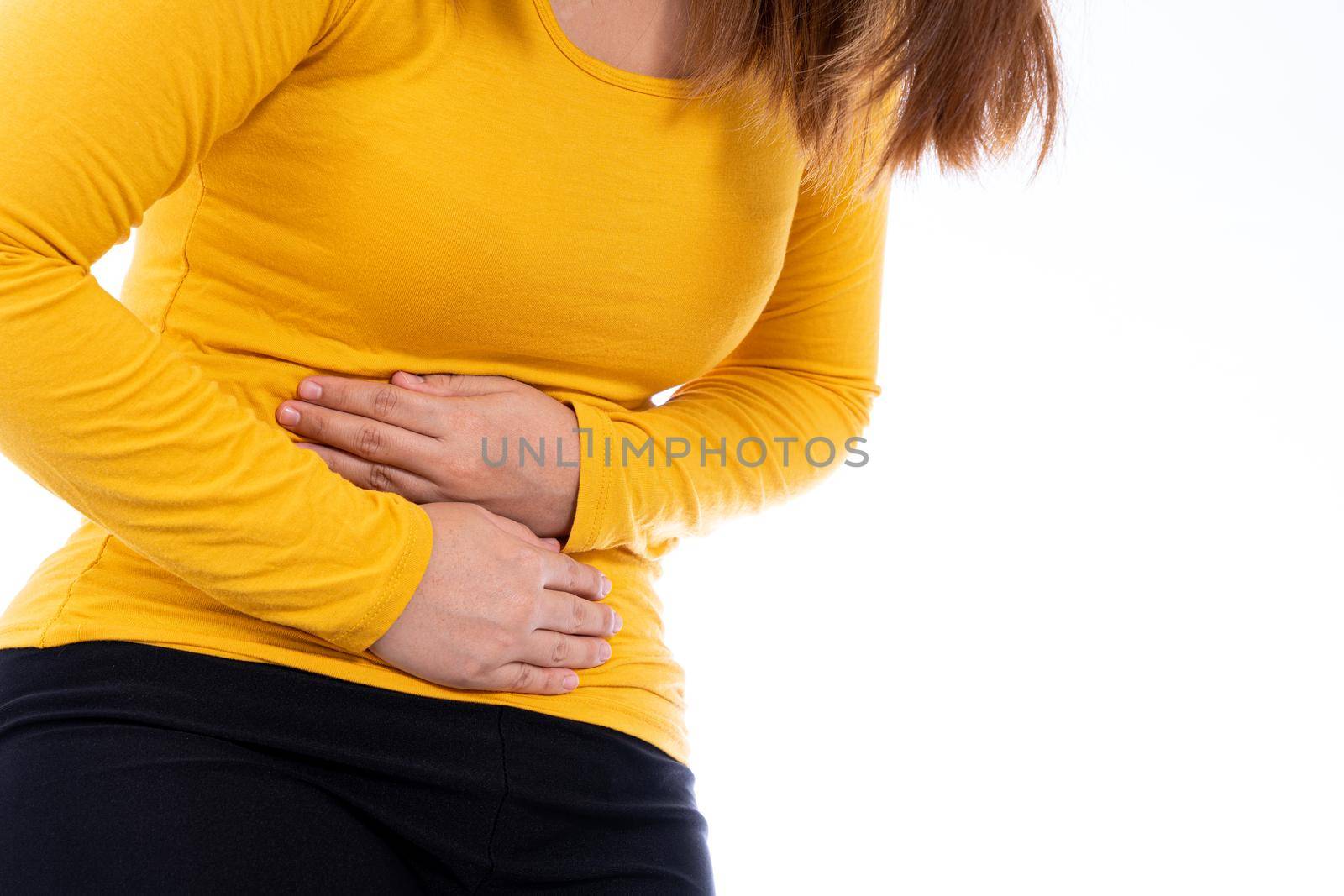 Woman suffering from stomach pain and injury isolated white background. Health care and medical concept. by mikesaran