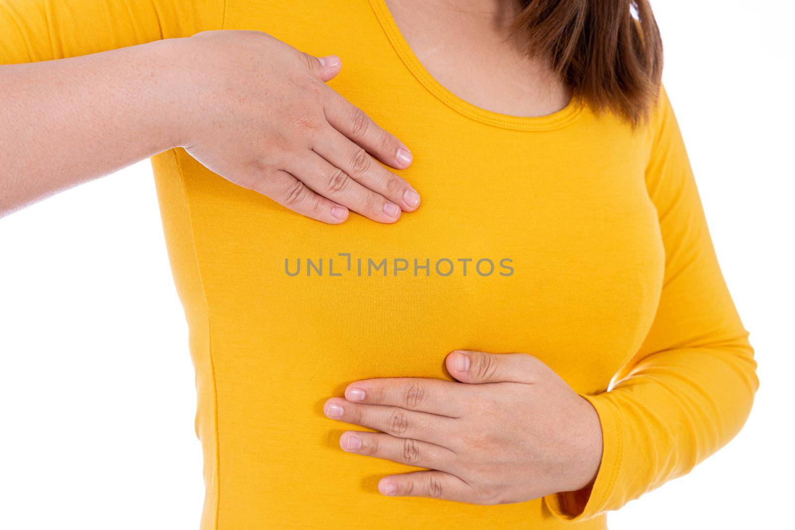 Woman hands doing breast self exam for checking lumps and signs of breast cancer isolated white background. Medical, healthcare for advertising concept.