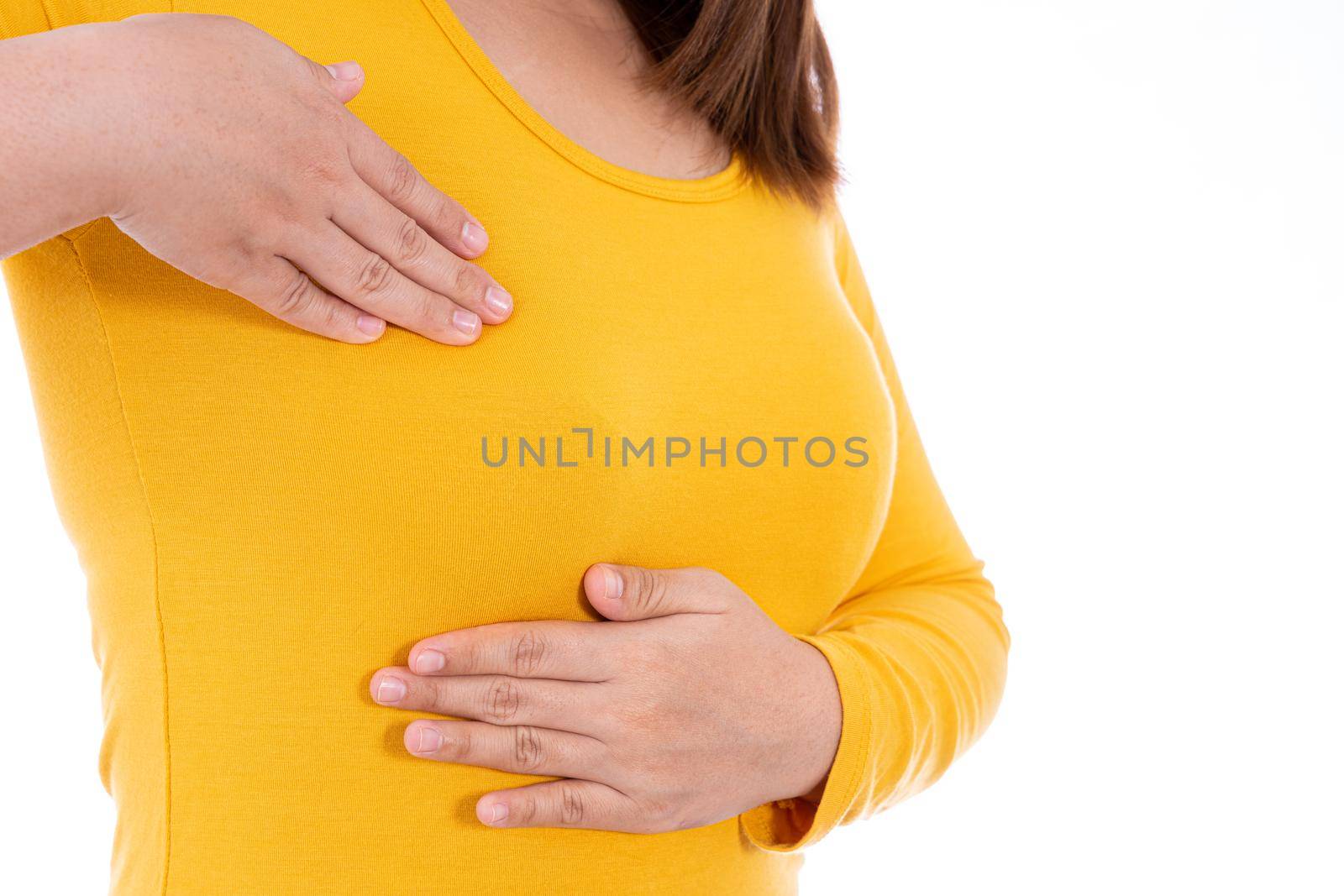 Woman hands doing breast self exam for checking lumps and signs of breast cancer isolated white background. Medical, healthcare for advertising concept. by mikesaran