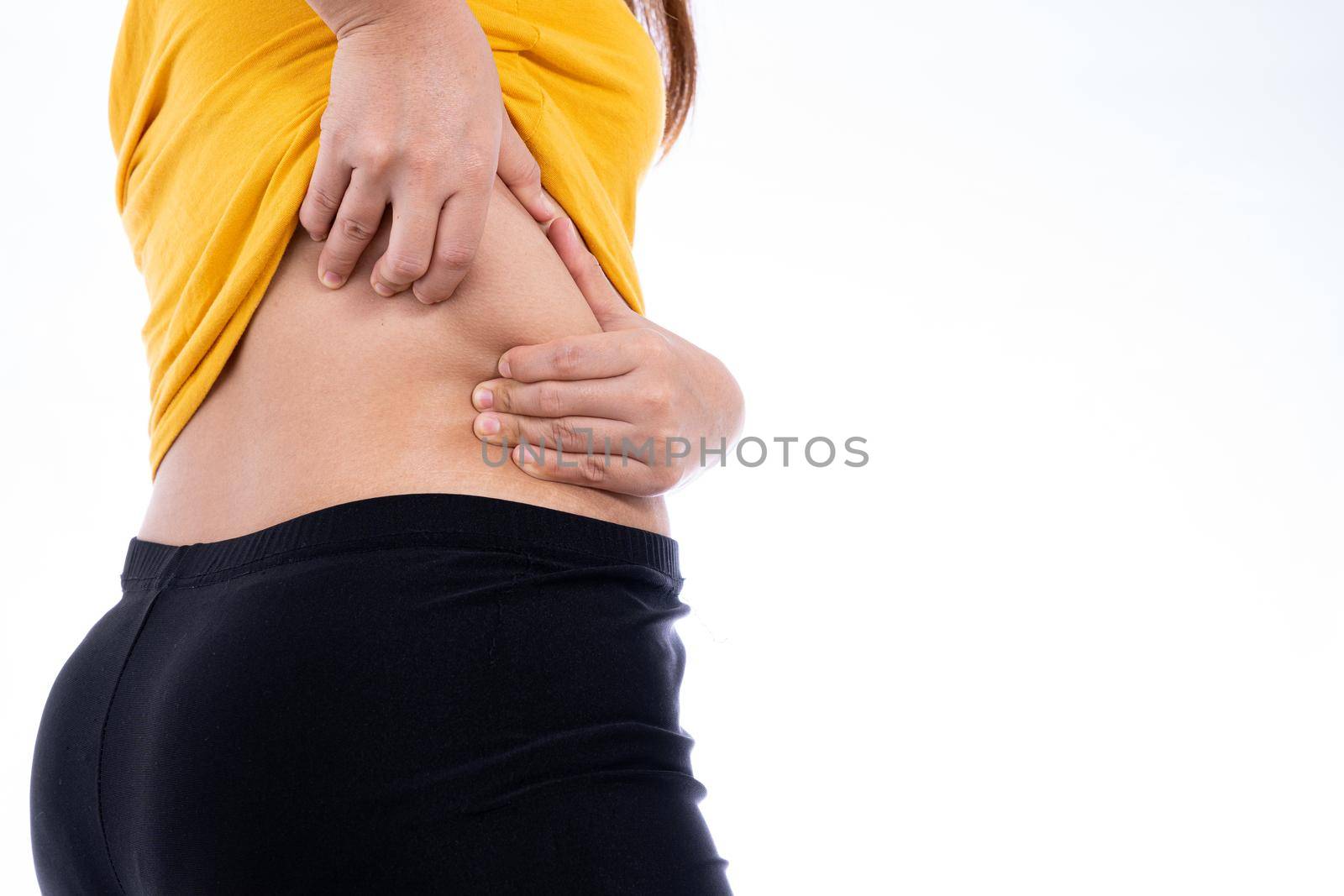 Fat woman holding excessive lower back, overweight fatty isolated white background. Diet lifestyle, weight loss, stomach muscle, healthy concept. by mikesaran