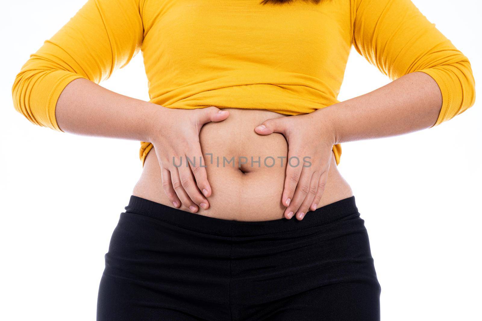Fat woman holding excessive fat belly, overweight fatty belly isolated white background. Diet lifestyle, weight loss, stomach muscle, healthy concept. by mikesaran