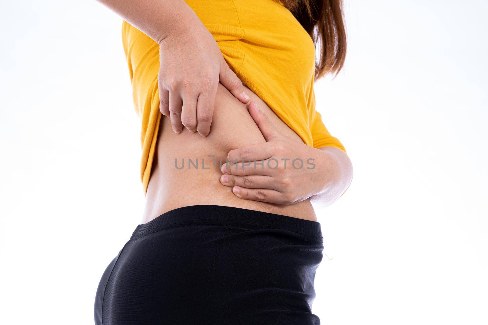 Fat woman holding excessive lower back, overweight fatty isolated white background. Diet lifestyle, weight loss, stomach muscle, healthy concept.