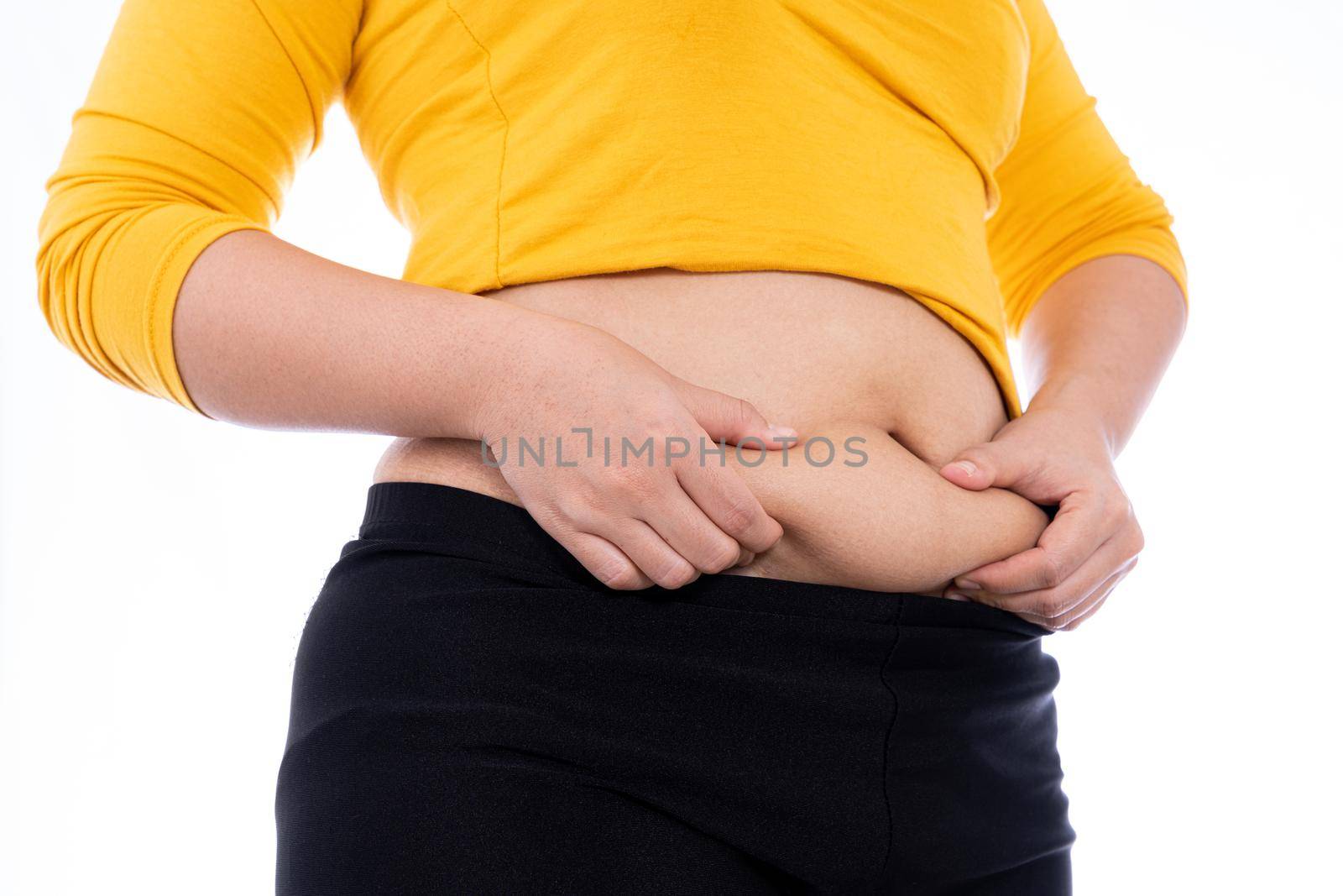 Fat woman holding excessive fat belly, overweight fatty belly isolated white background. Diet lifestyle, weight loss, stomach muscle, healthy concept.