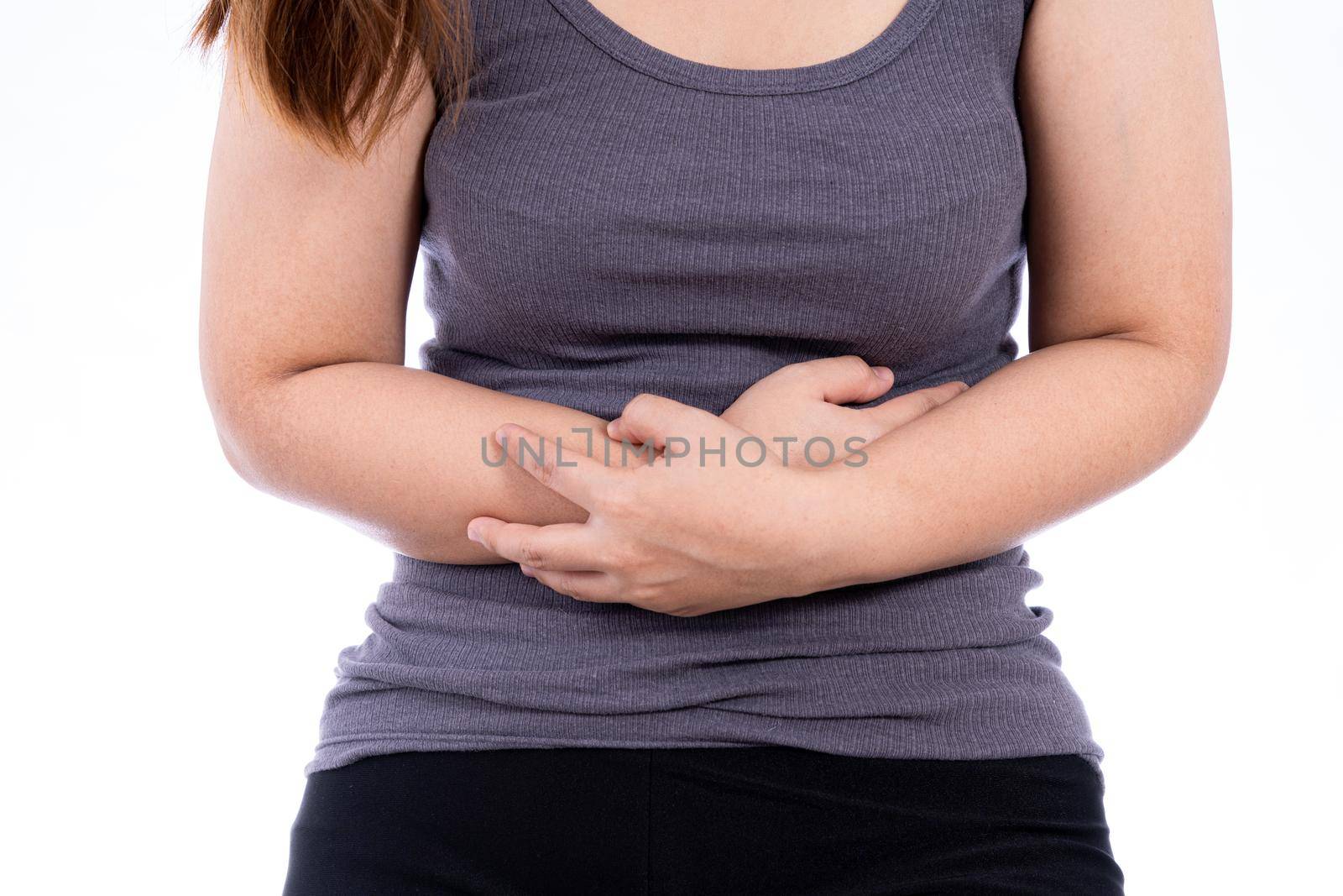 Woman suffering from stomach pain and injury isolated white background. Health care and medical concept. by mikesaran