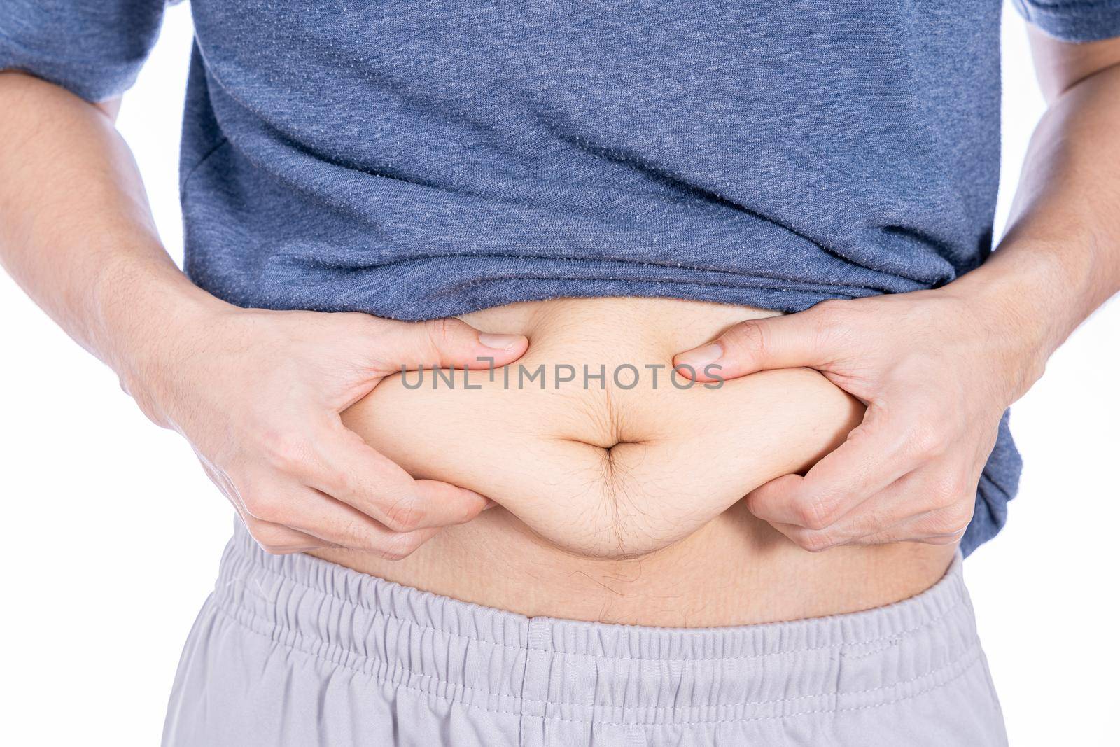 Fat man holding excessive fat belly, overweight fatty belly isolated white background. Diet lifestyle, weight loss, stomach muscle, healthy concept. by mikesaran