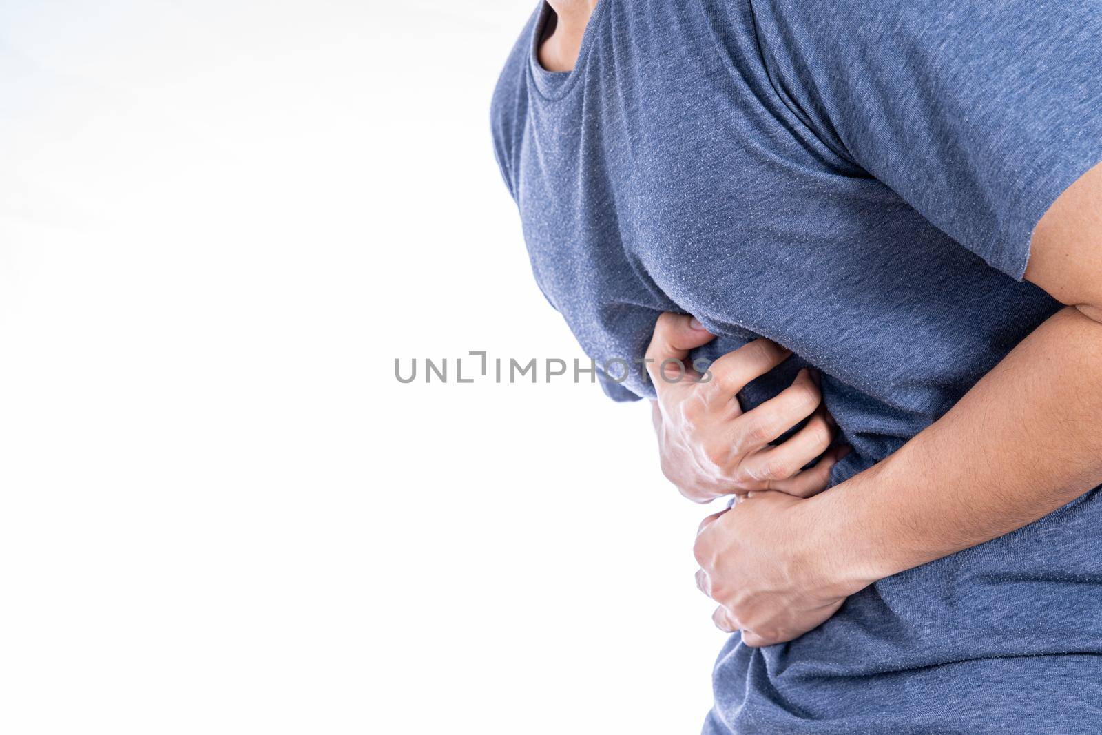 Man suffering from stomach pain and injury isolated white background. Health care and medical concept. by mikesaran