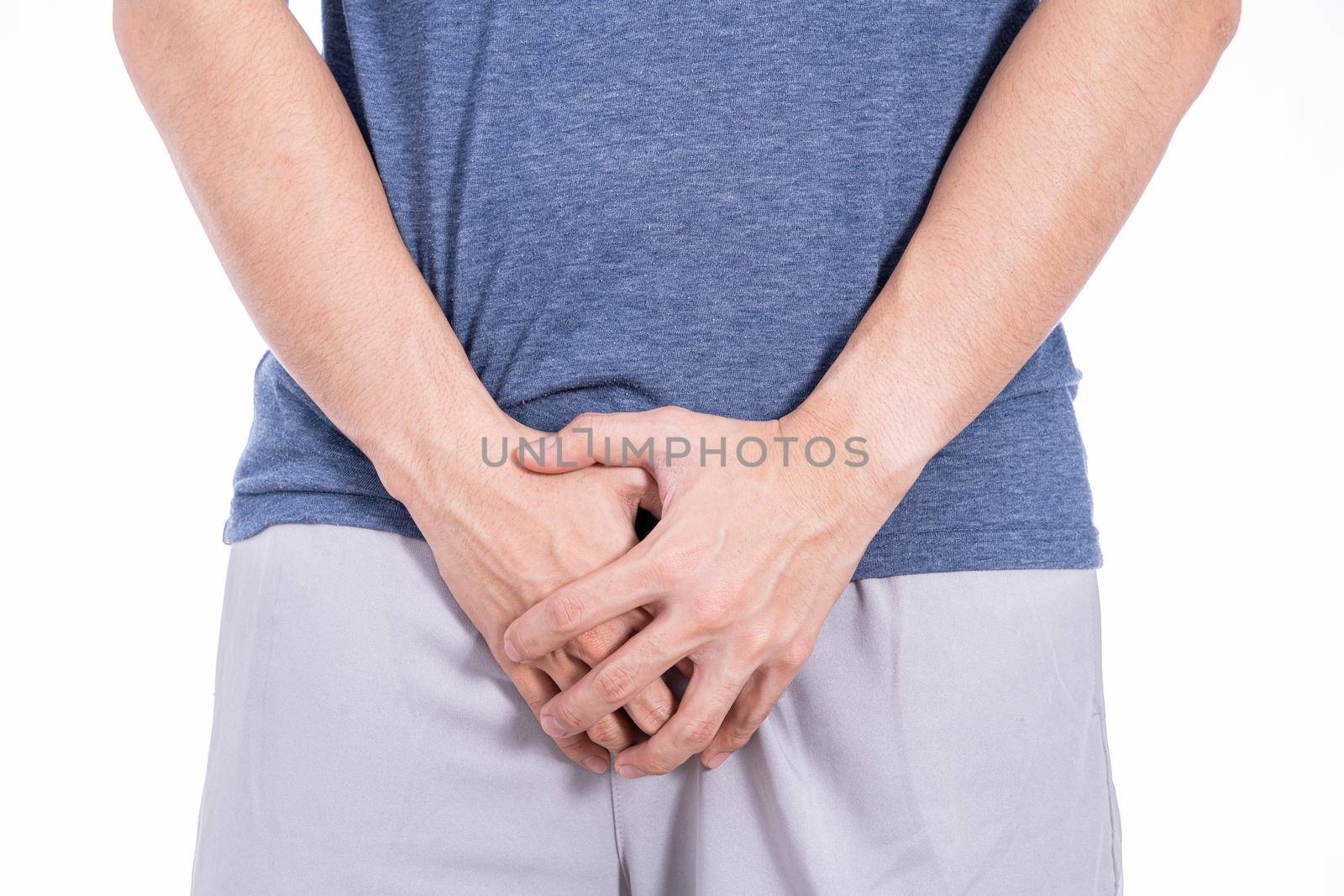 Man hands holding his crotch isolated white background. Medical, healthcare for advertising concept. by mikesaran