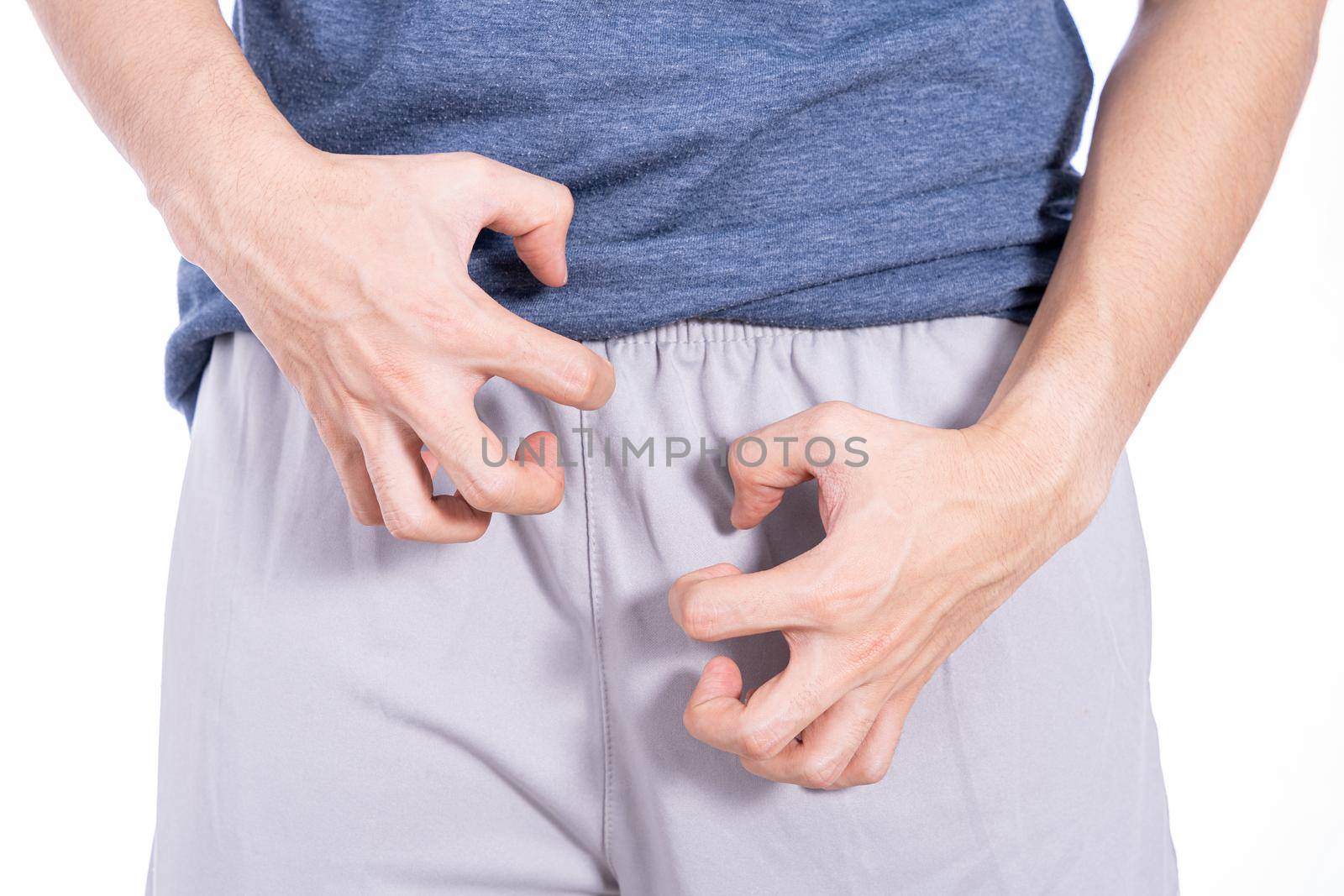 Man hands scratching his crotch isolated white background. Medical, healthcare for advertising concept. by mikesaran