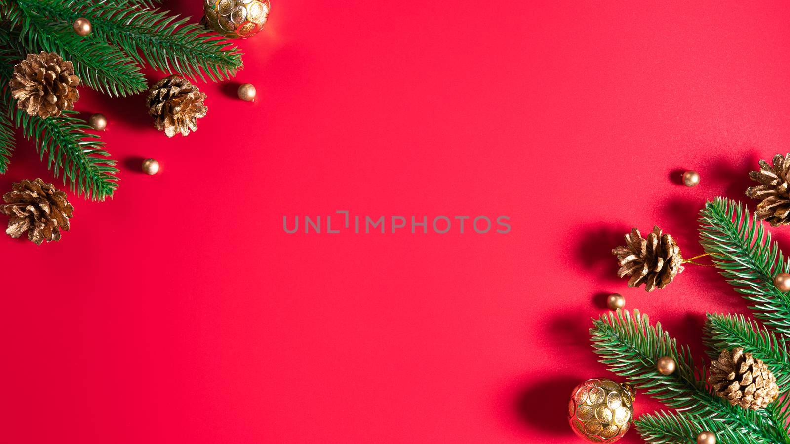 Christmas background. Top view of Christmas decorations on red background with copy space for text. Flat lay, winter, postcard template, new year concept.