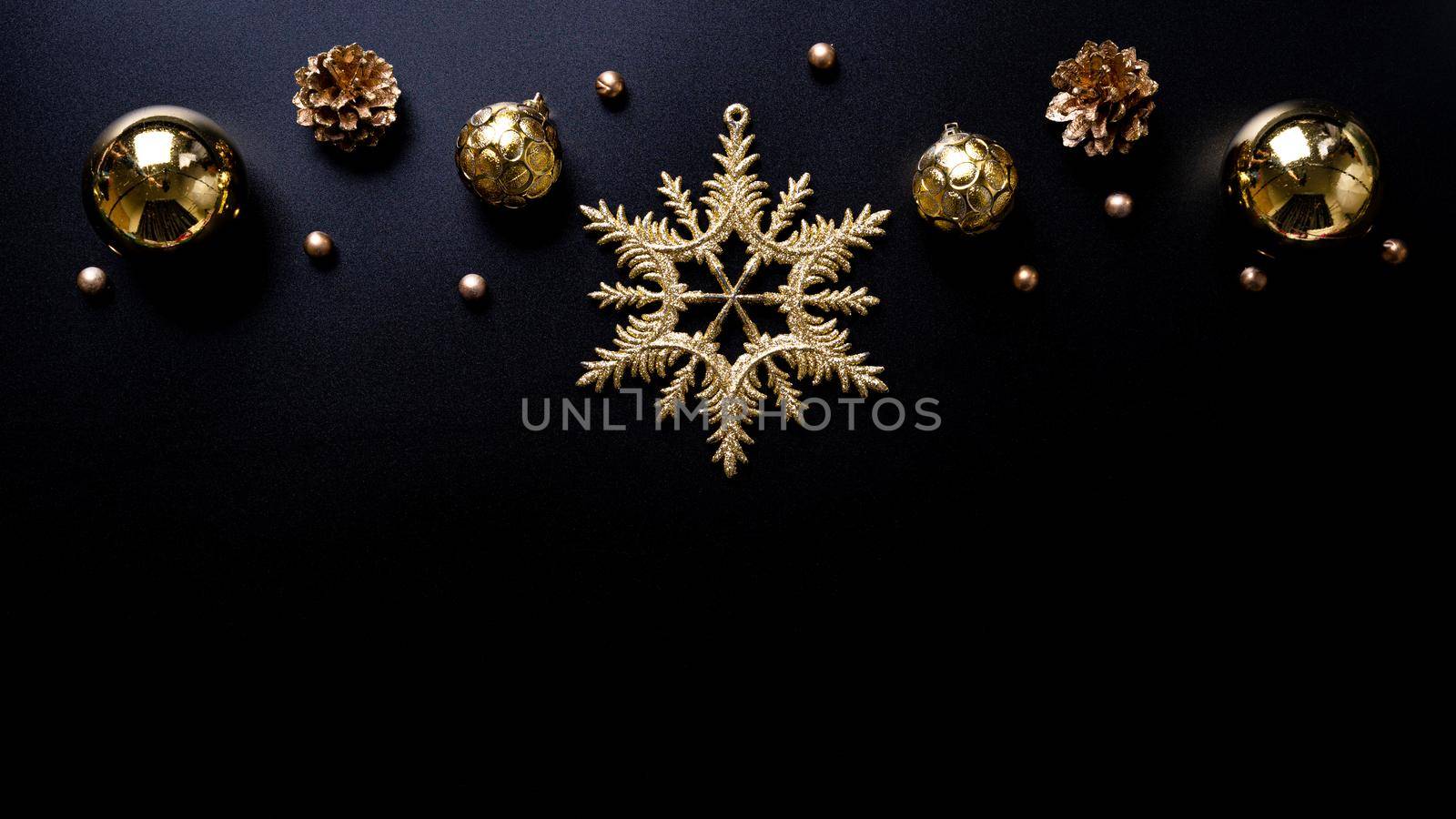 Christmas background. Top view of Christmas decorations on black background with copy space for text. Flat lay, winter, postcard template, new year concept.