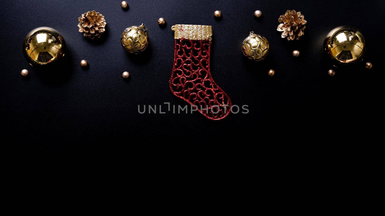 Christmas background. Top view of Christmas decorations on black background with copy space for text. Flat lay, winter, postcard template, new year concept.