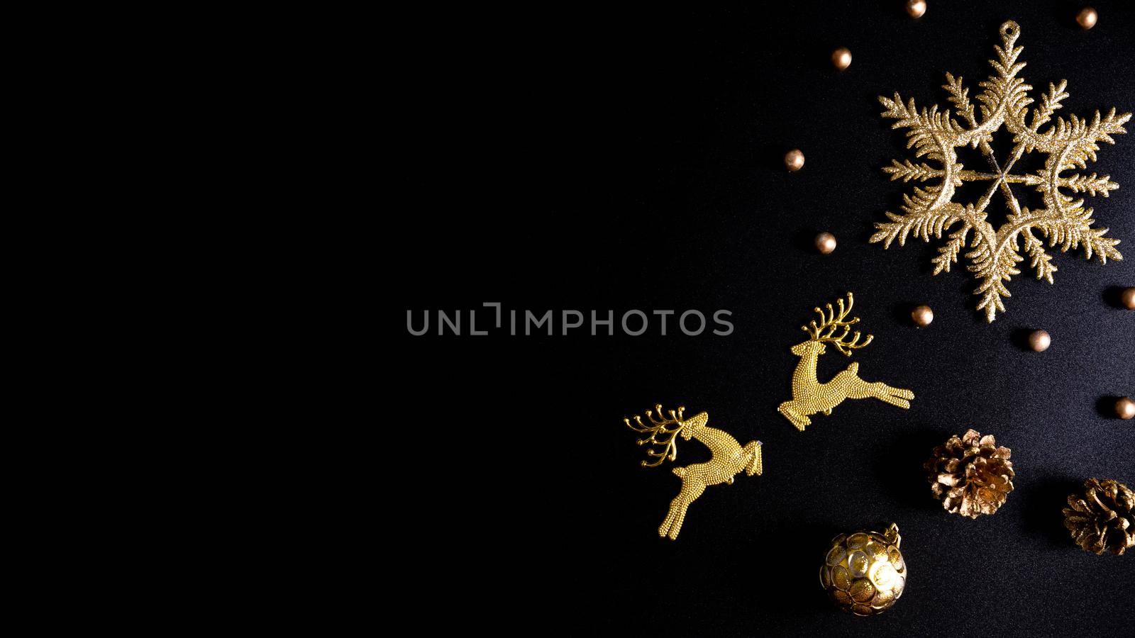 Christmas background. Top view of Christmas decorations on black background with copy space for text. Flat lay, winter, postcard template, new year concept.