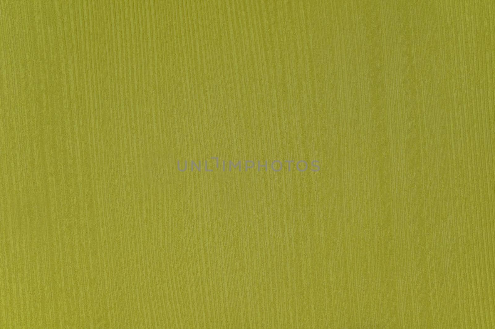 Rough textured surface imitation of mustard-colored wood close-up.Texture or background