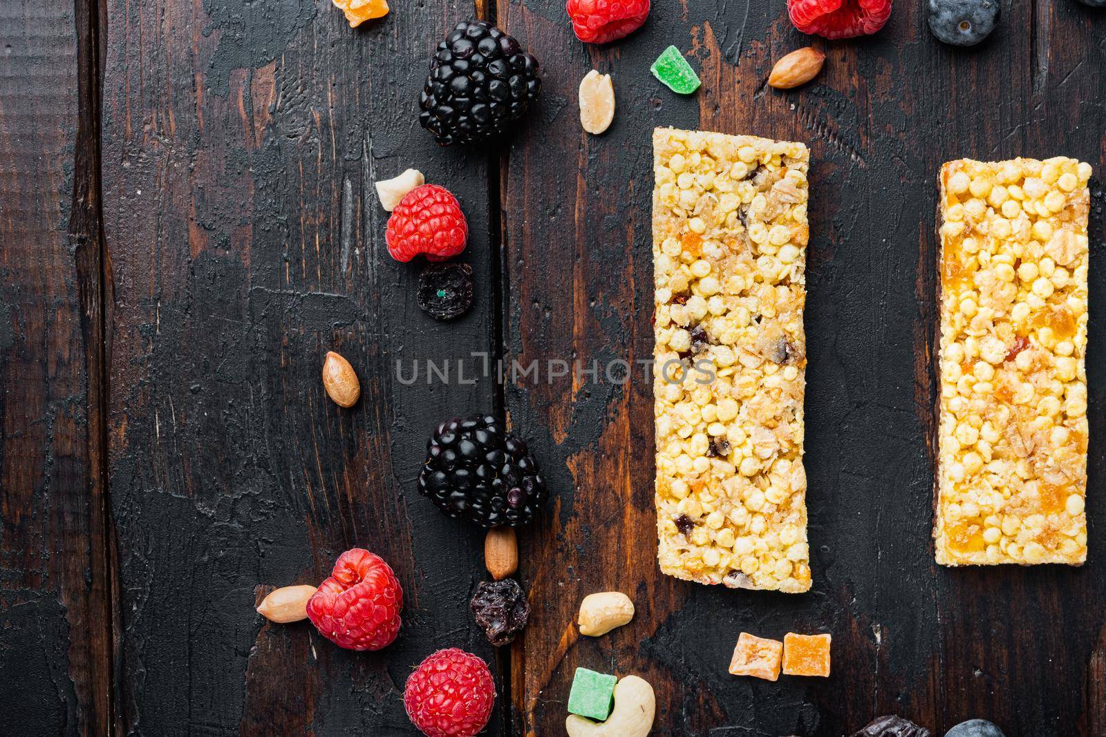 Healthy snacks, fitness lifestyle and high fiber diet concept, top view with copy space, on wooden table by Ilianesolenyi