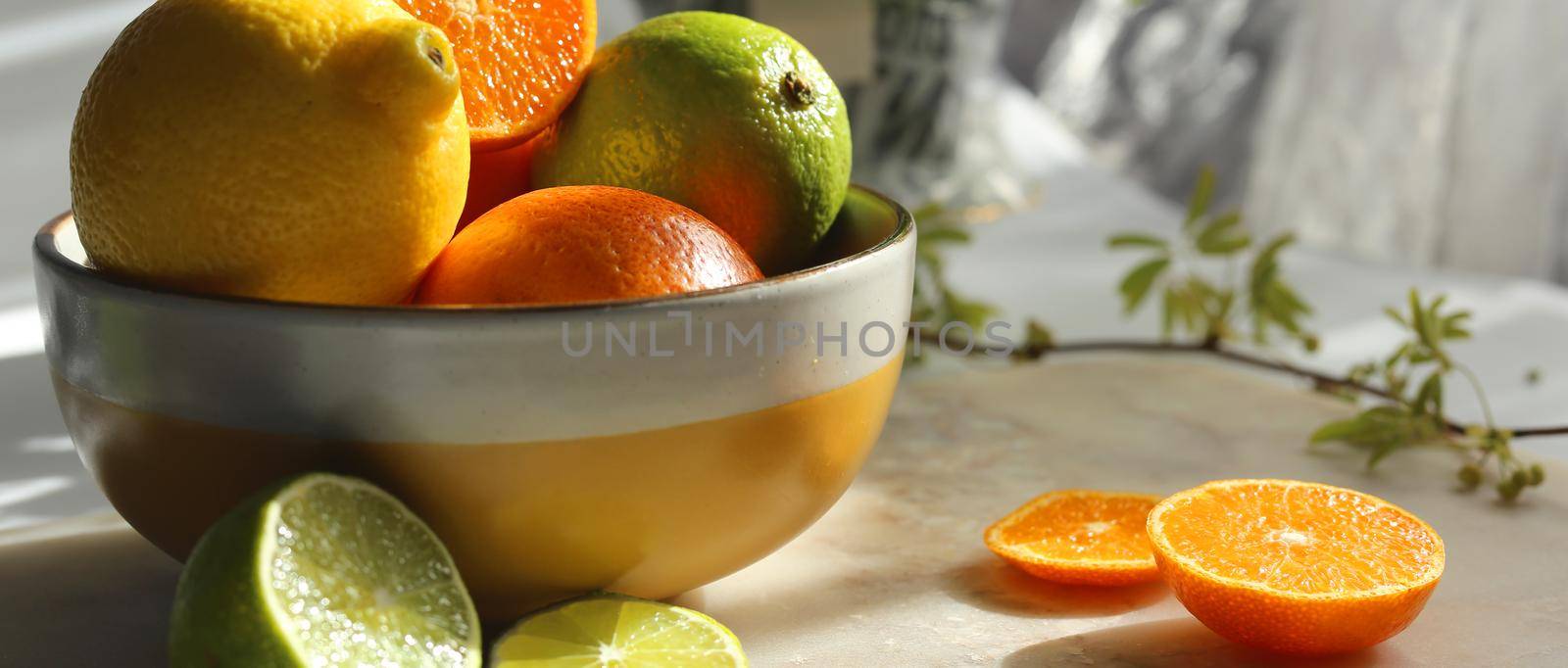 rustic kitchen with citrus fruits. Lime, orange mint lemon in kitchen ball on white table