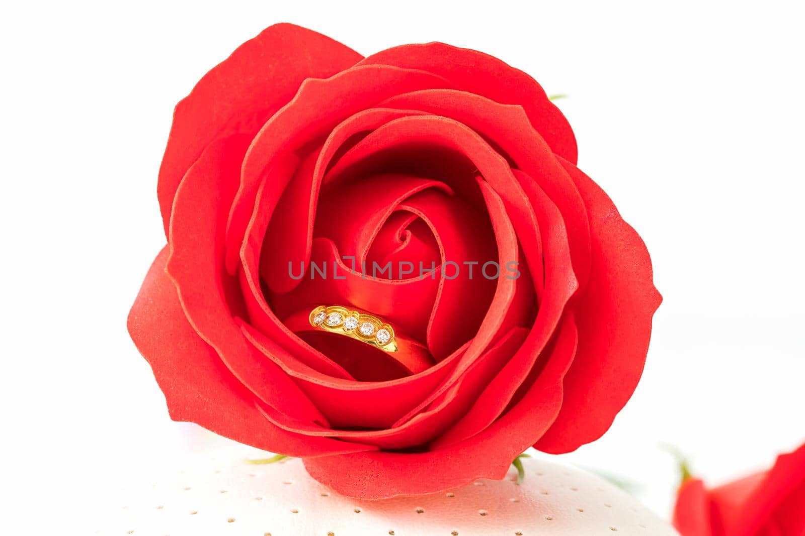 Close up Red roses on white background, Wedding concept with roses and gold rings