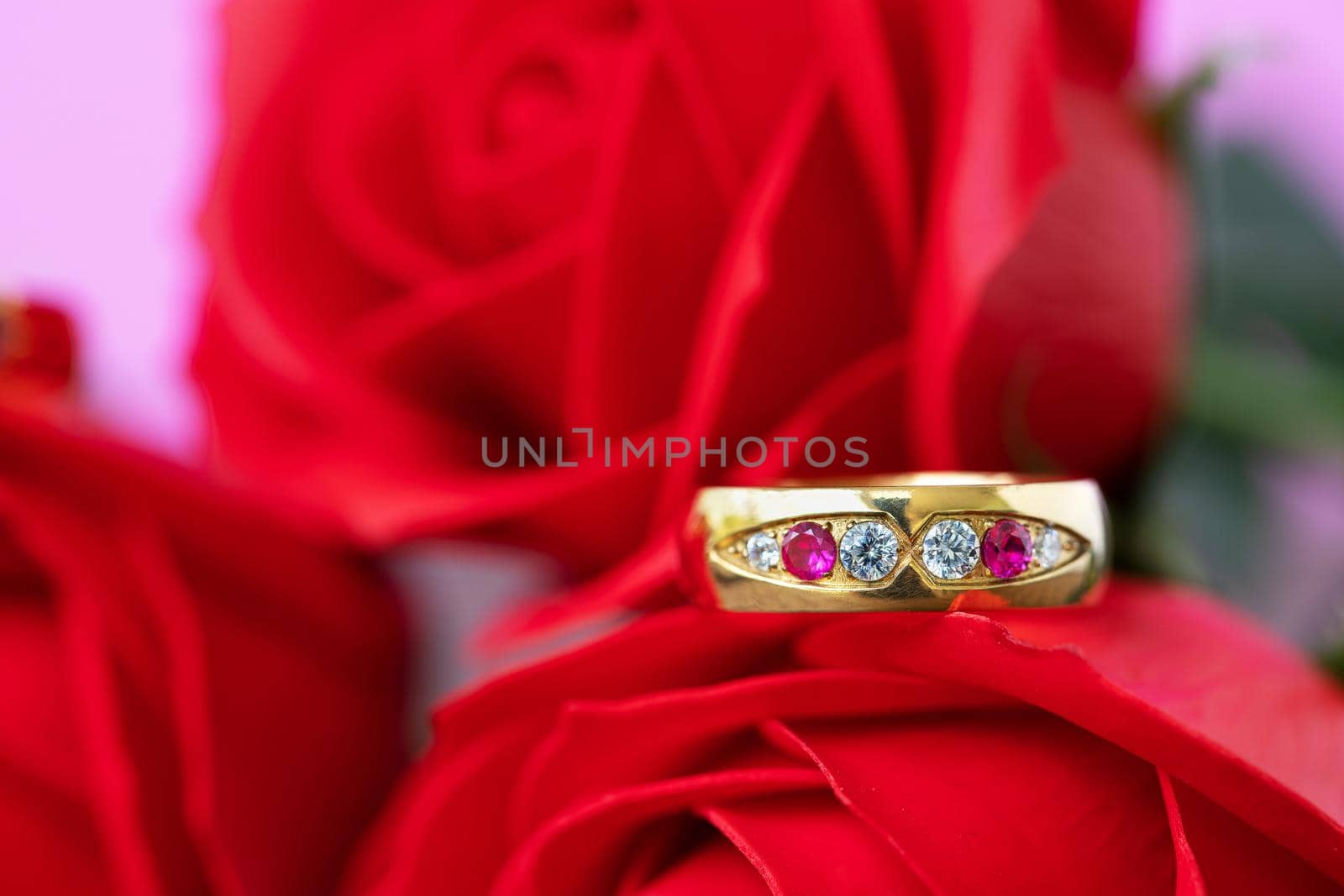 Close up wedding ring and red rose . Love concept